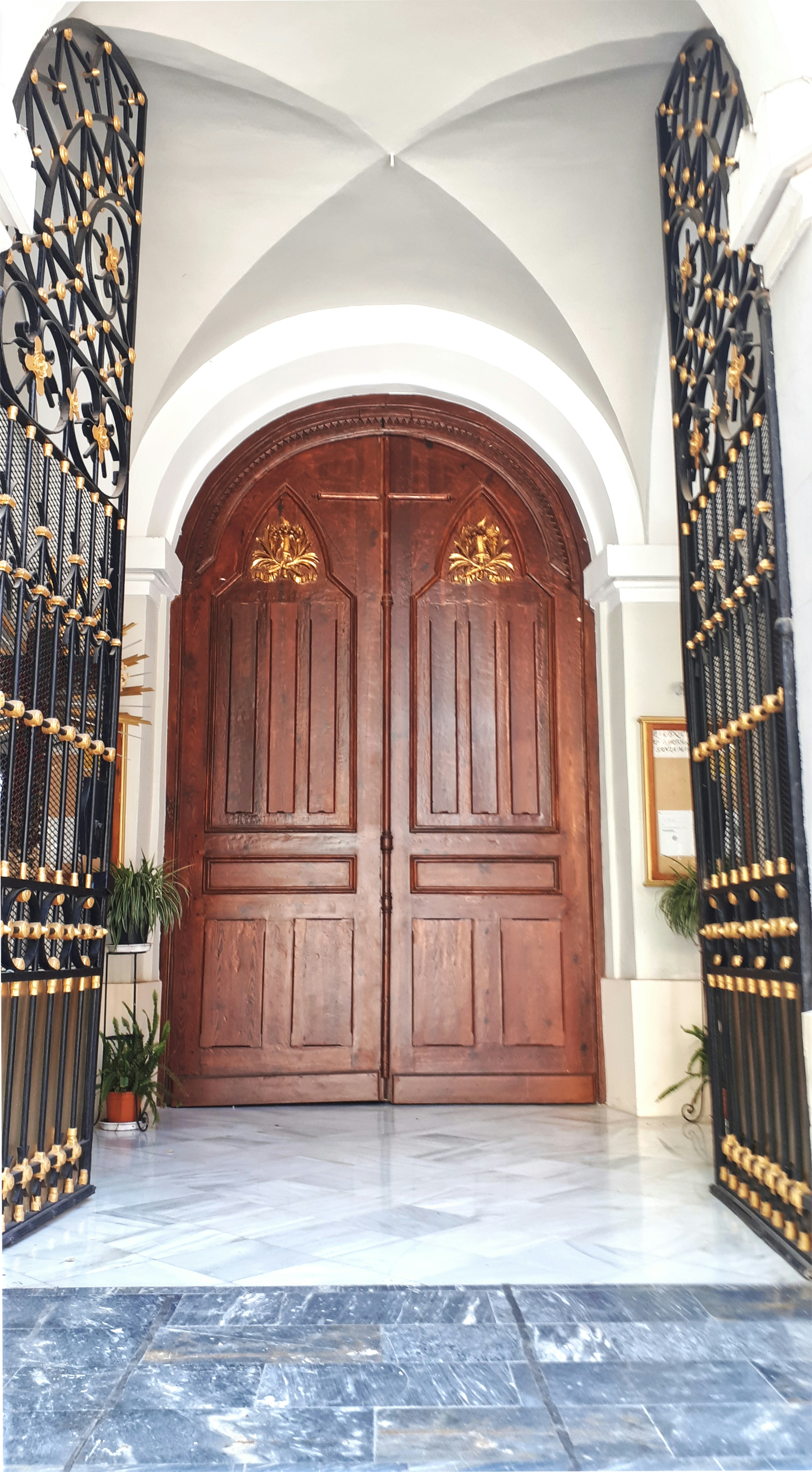 THE BEAUTIFUL DOORS AND GATES ARE THE ENTRANCE TO THE PARROQUIA SAN BARTOLOME SANTA MARIA IN OLD TOWN MURCIA