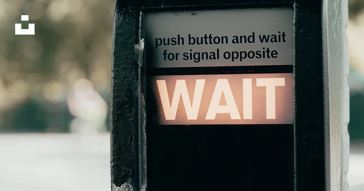 Wait Button A crosswalk button says