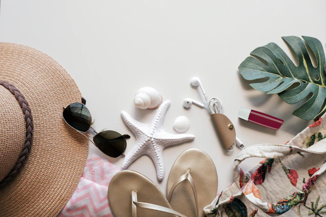 Summer essentials arranged on a white surface.