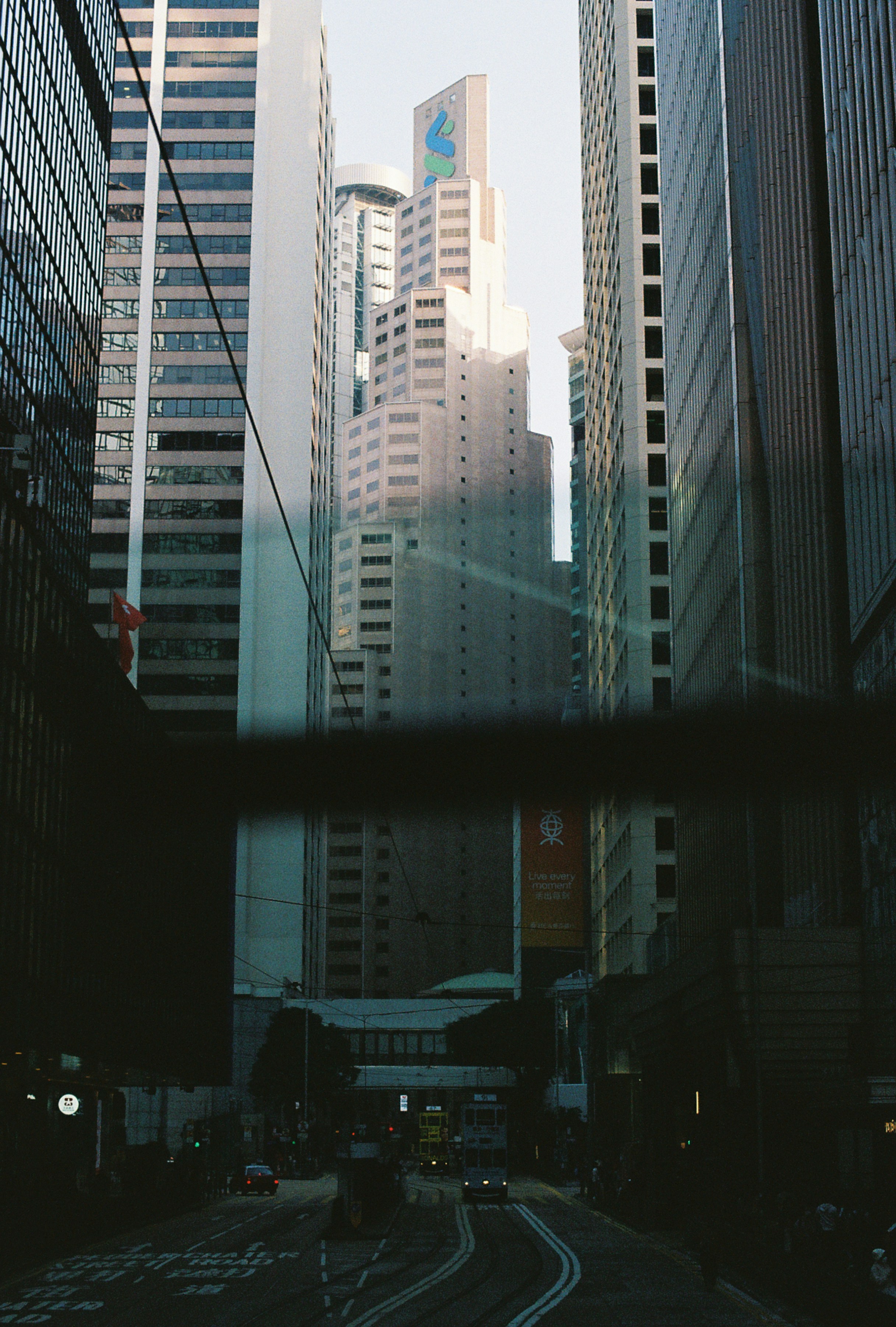 Tall buildings line a city street.