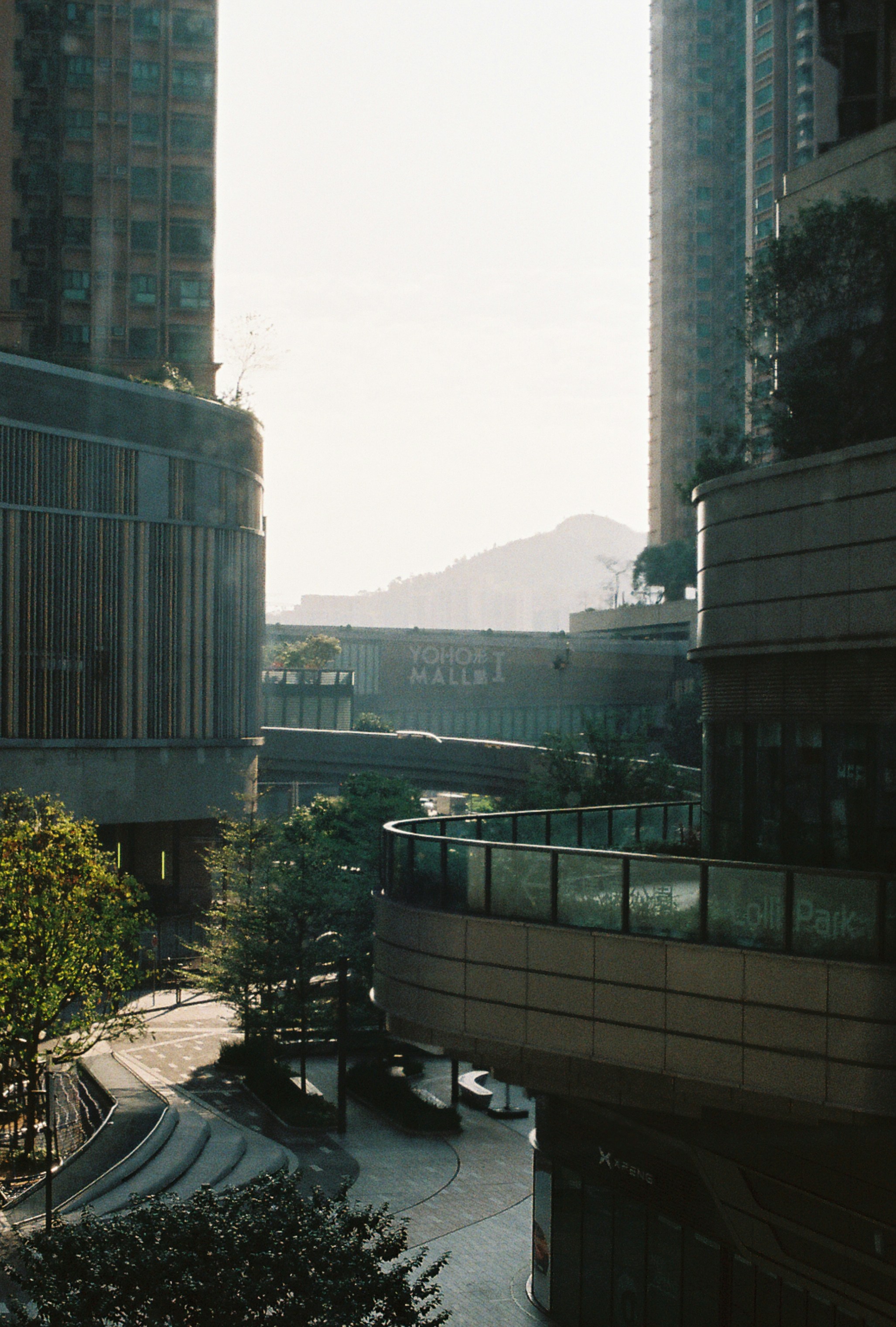 Urban buildings with a mountain in the distance.