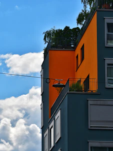 Modern building boasts bold colors against the blue sky.