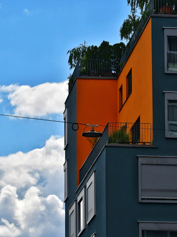 Modern building boasts bold colors against the blue sky.