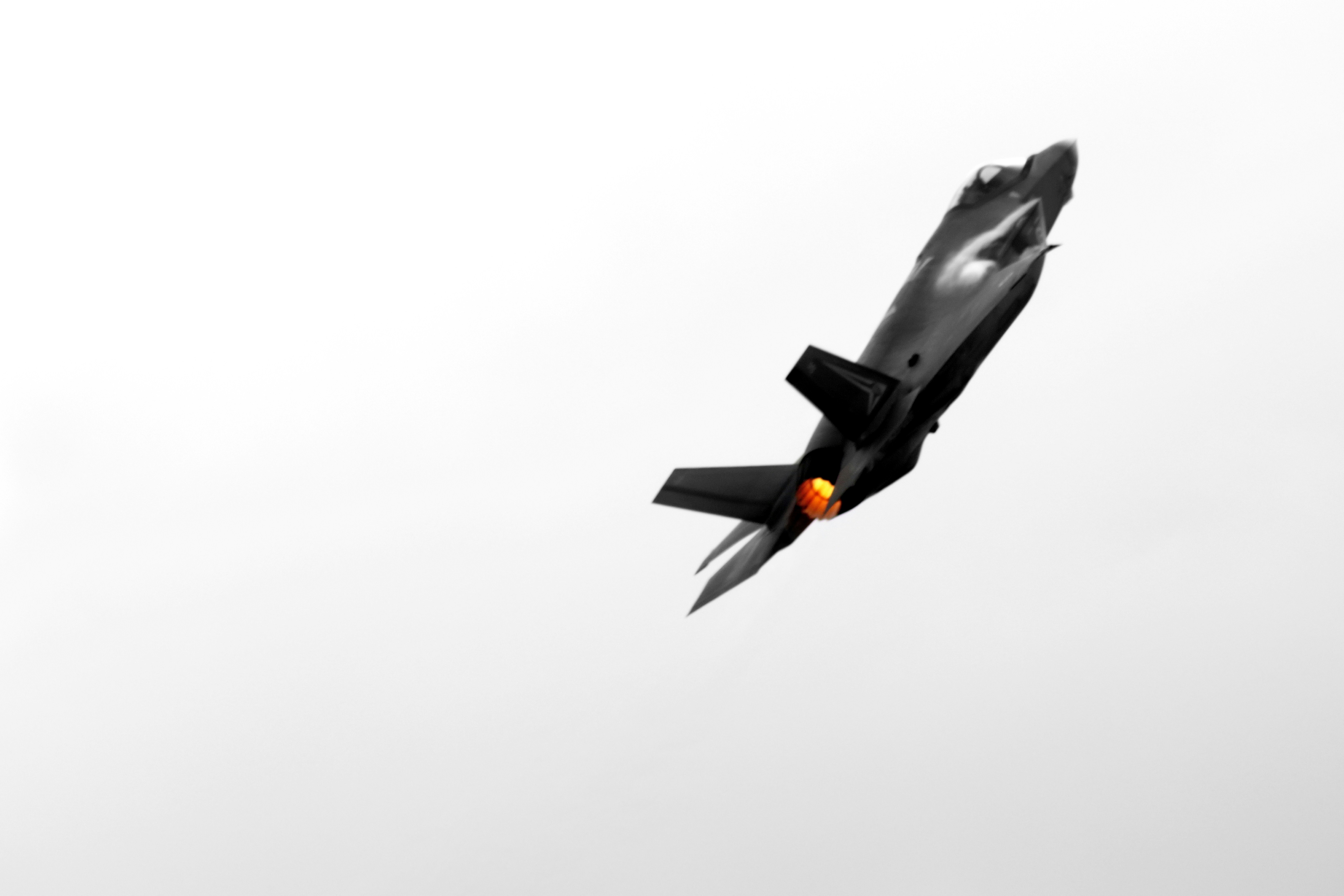 A stealth fighter jet soars through the air