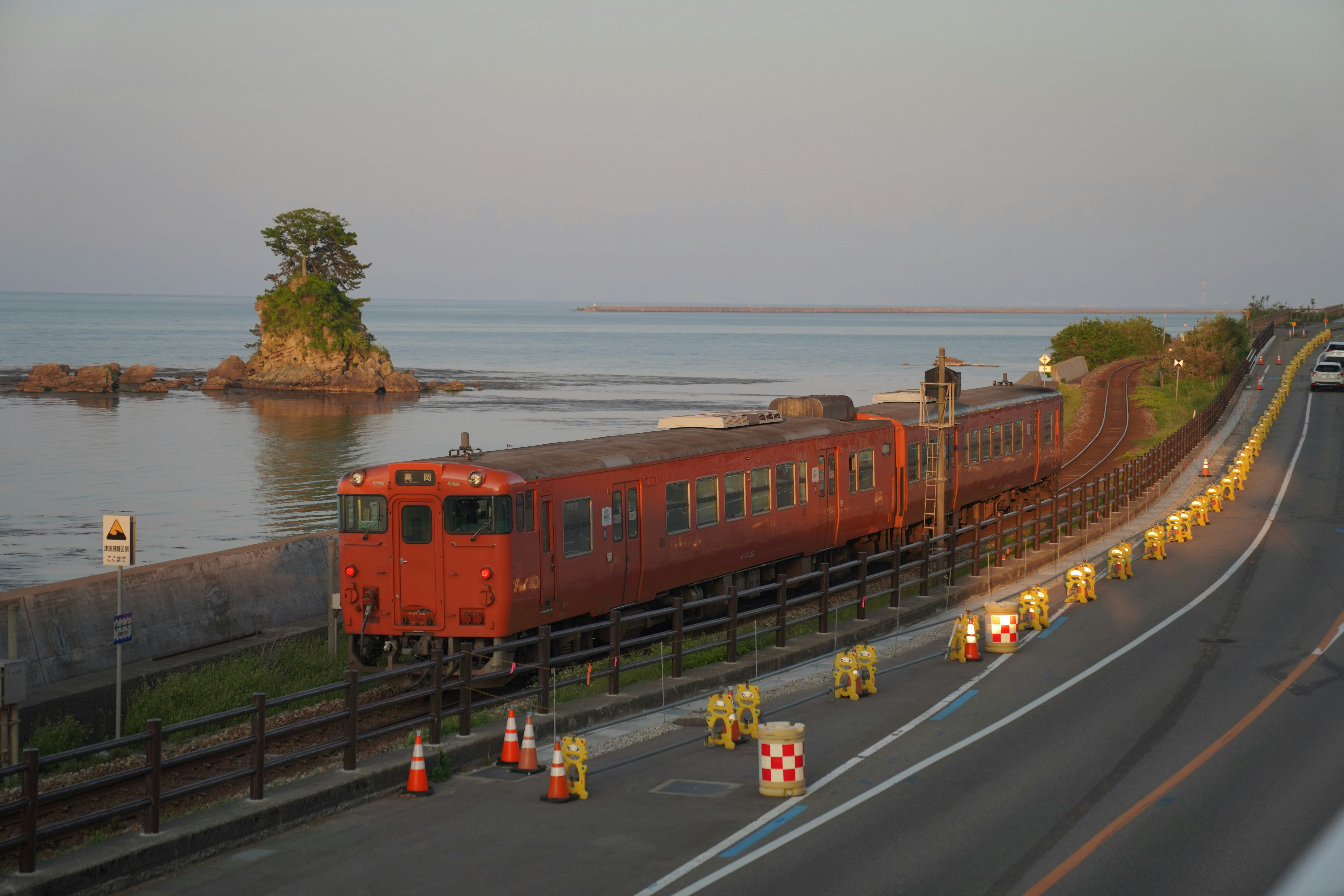 A train travels along a seaside route.