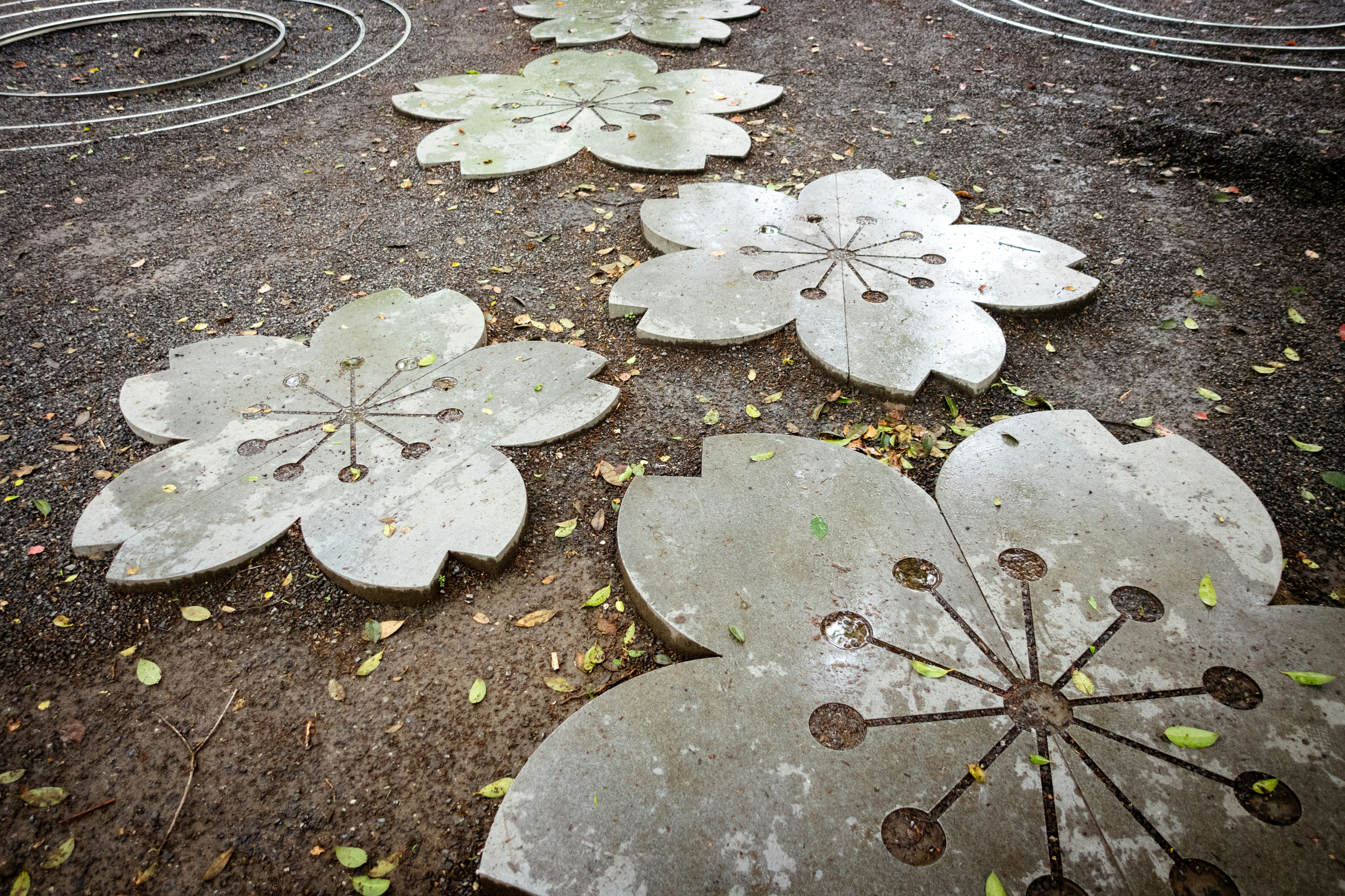 Stone flower pavers adorn a path.
