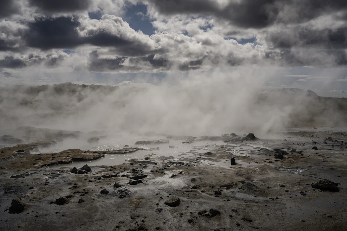 Steam rising from geothermal vents across the Rift Valley landscape