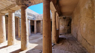 Ancient ruins with columns and sunlight.