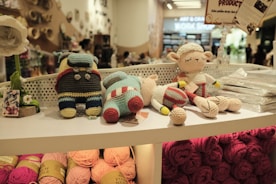 Stuffed animals are displayed on a store shelf.