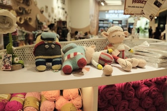 Stuffed animals are displayed on a store shelf.