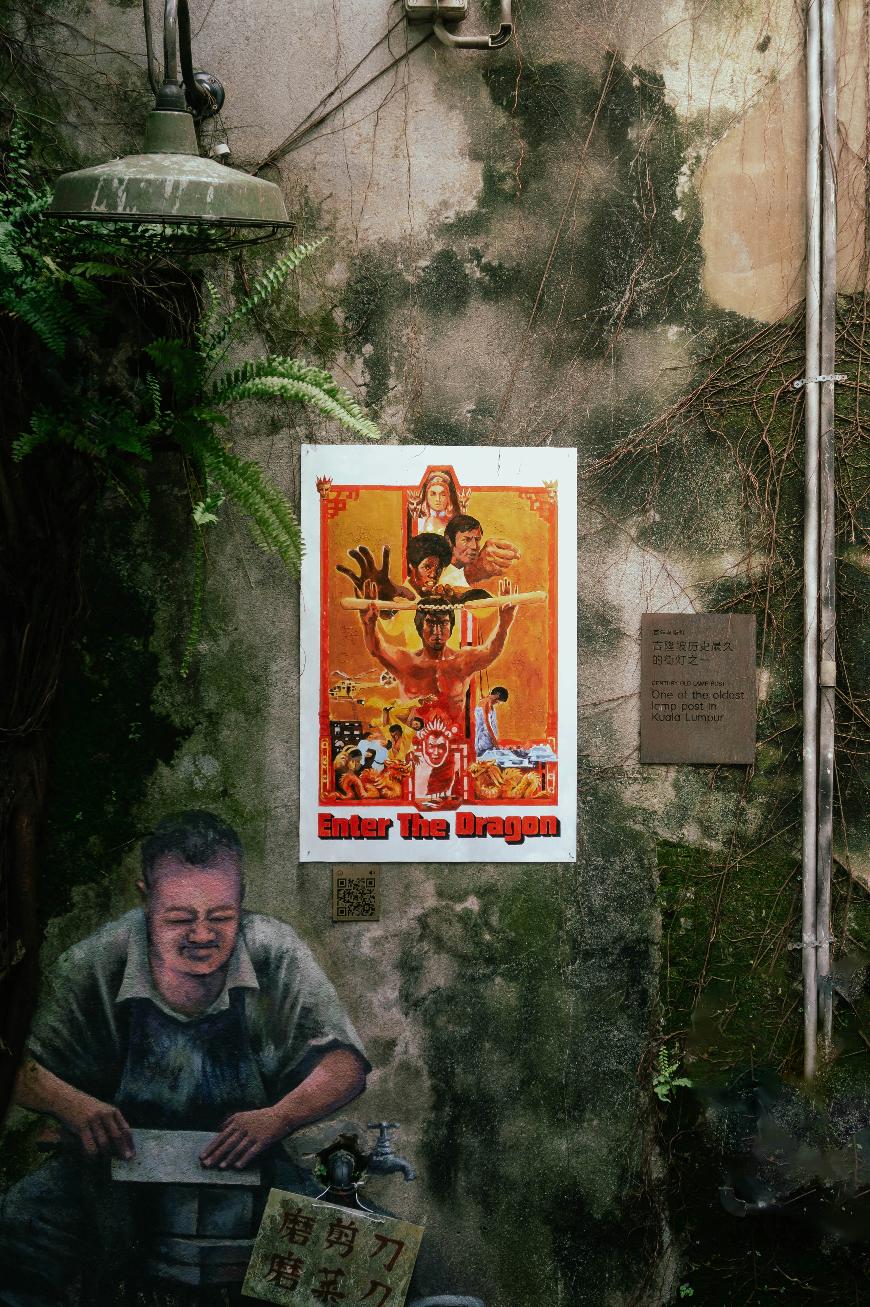 A poster for "enter the dragon" adorns a grimy wall.