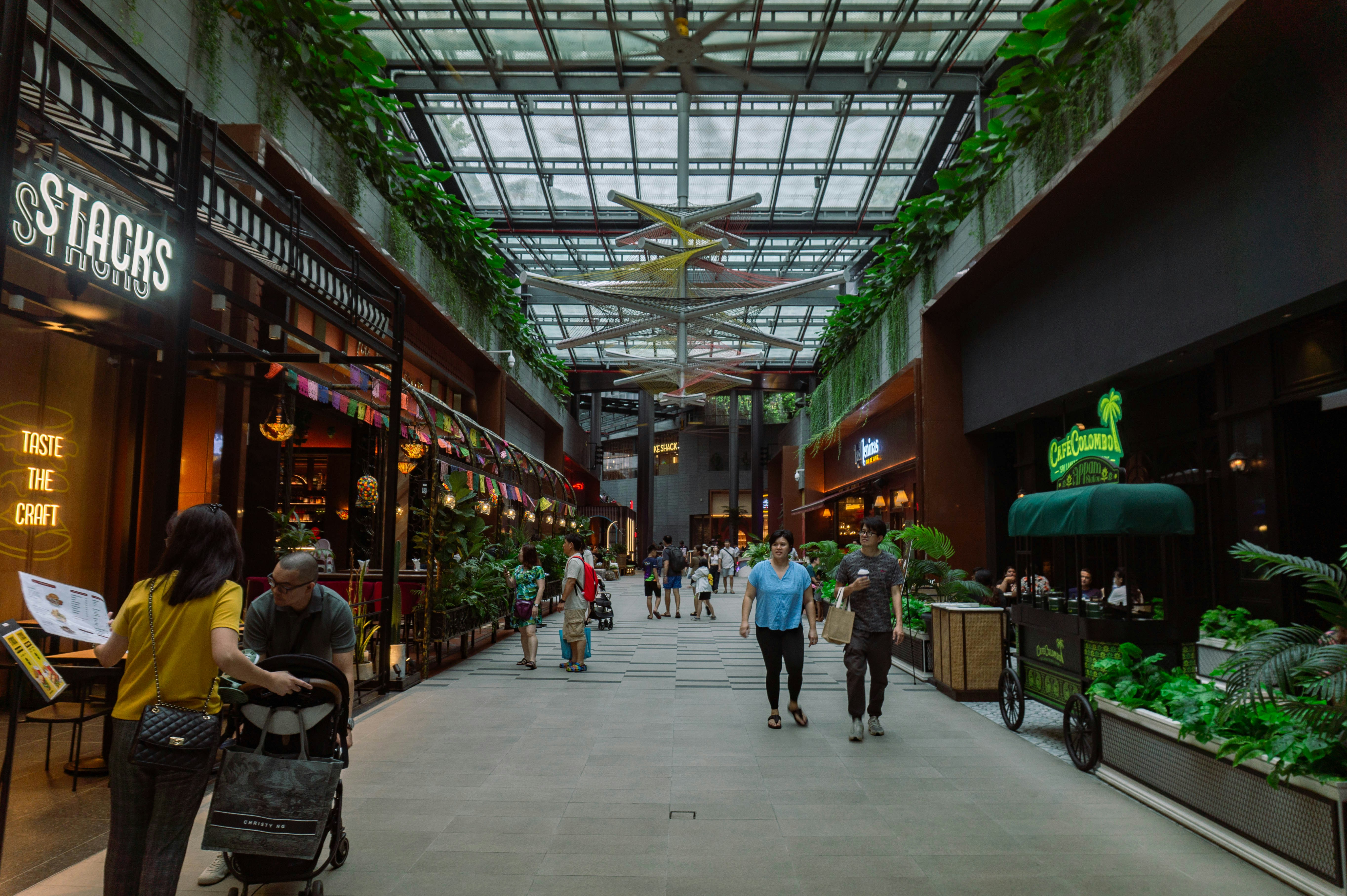 A modern mall with shops and people walking