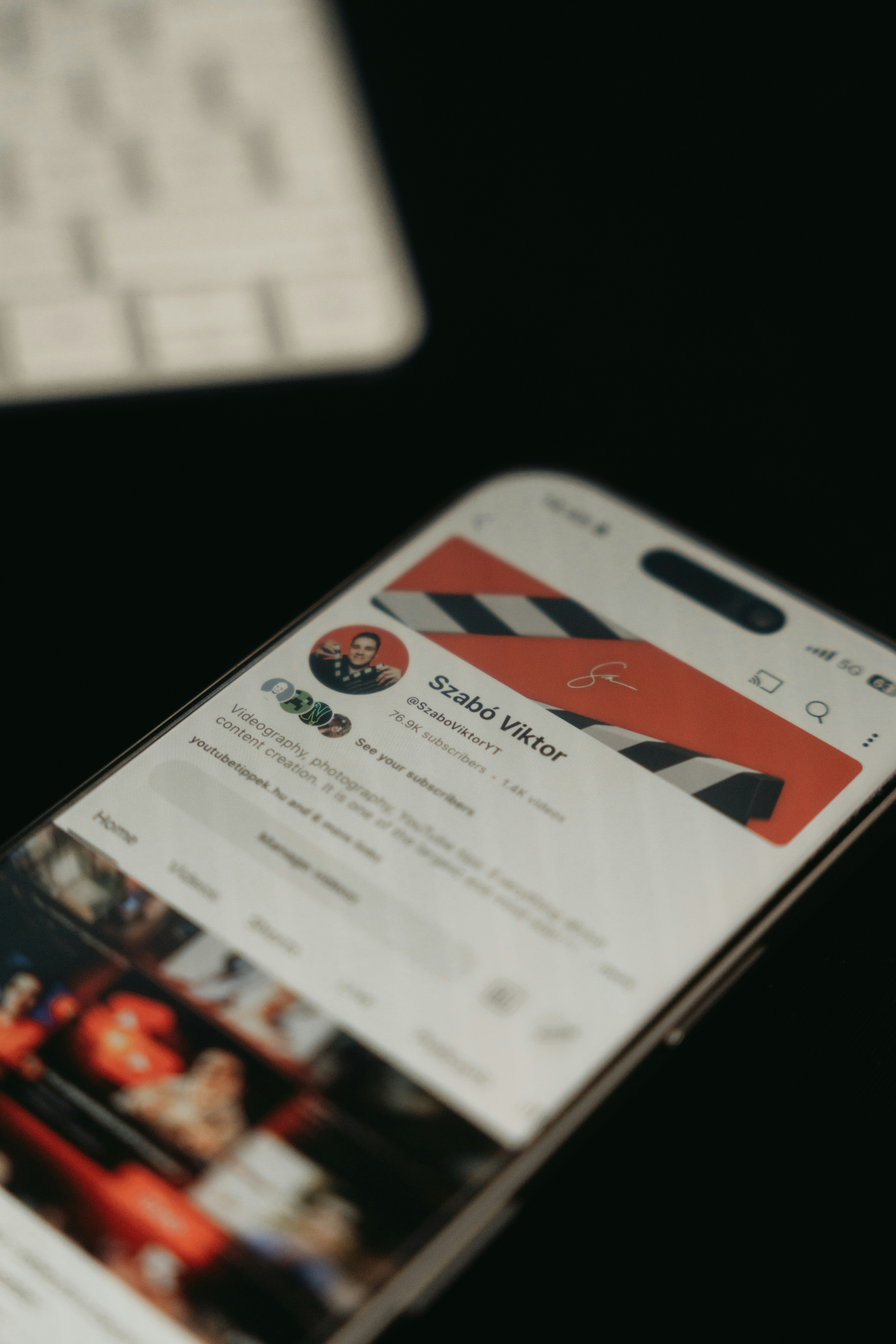 A phone displays a social media profile.