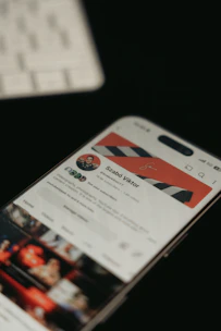 A phone displays a social media profile.