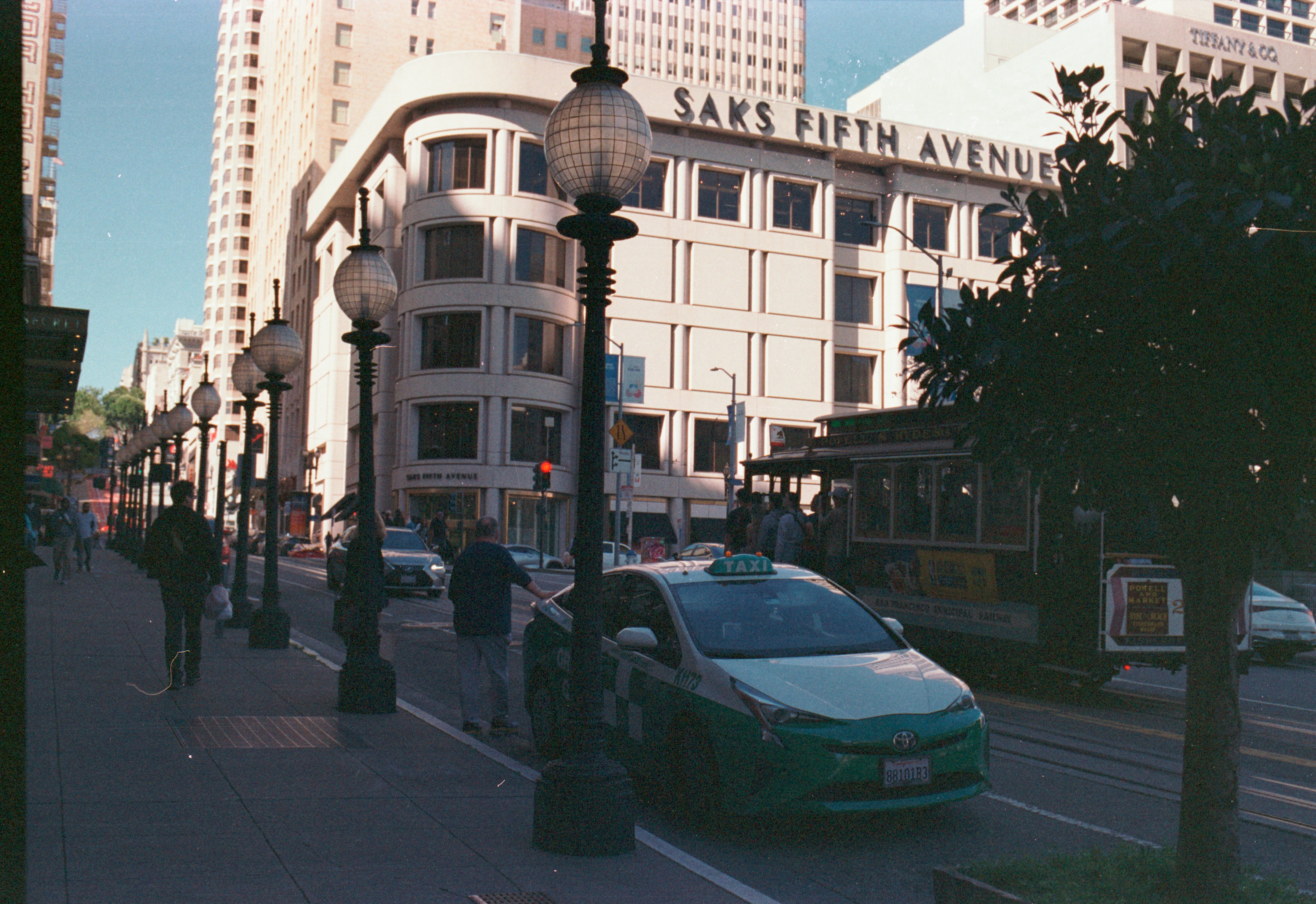A san francisco street scene with a cable car.