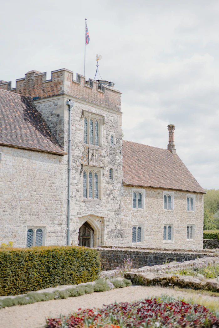 A stone manor house in open parkland