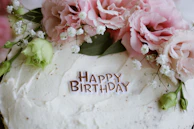 A birthday cake decorated with flowers.