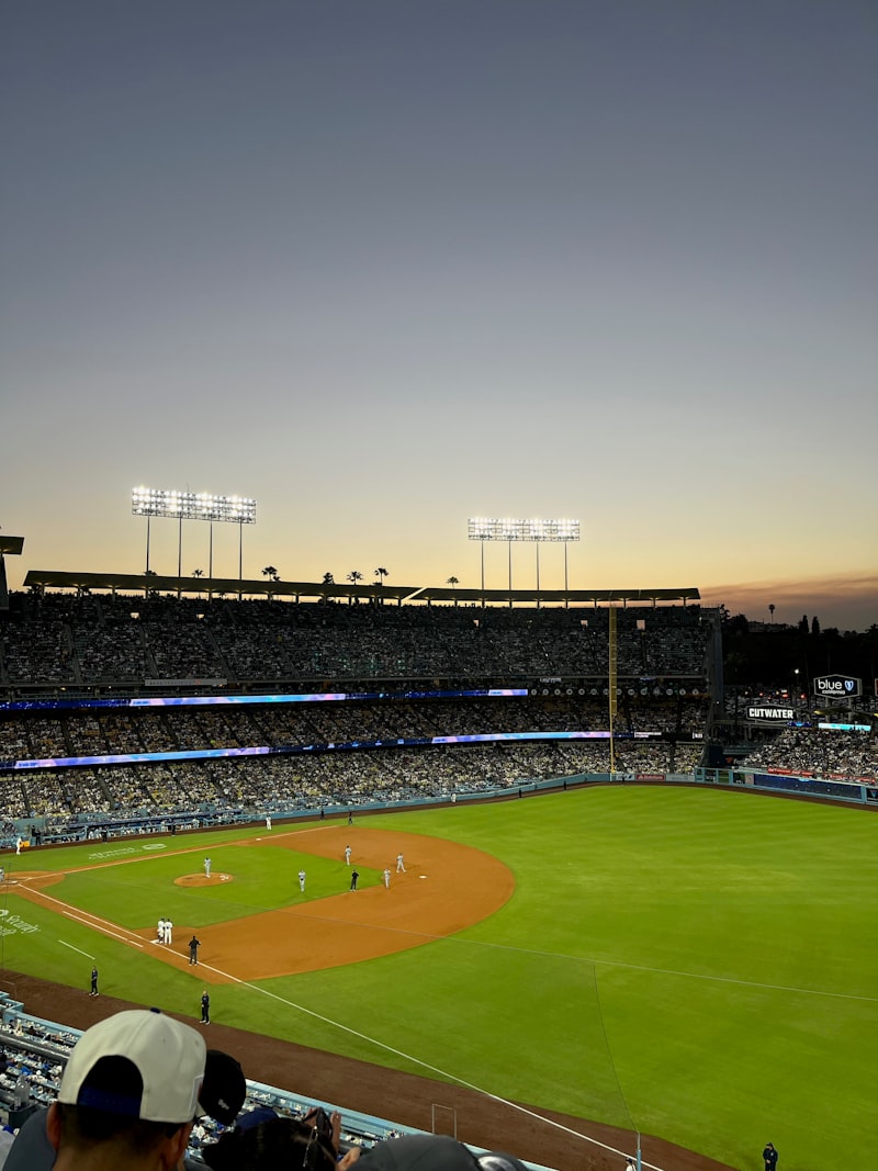 baseball player batting, baseball stadium, right field stands, home run, baseball game