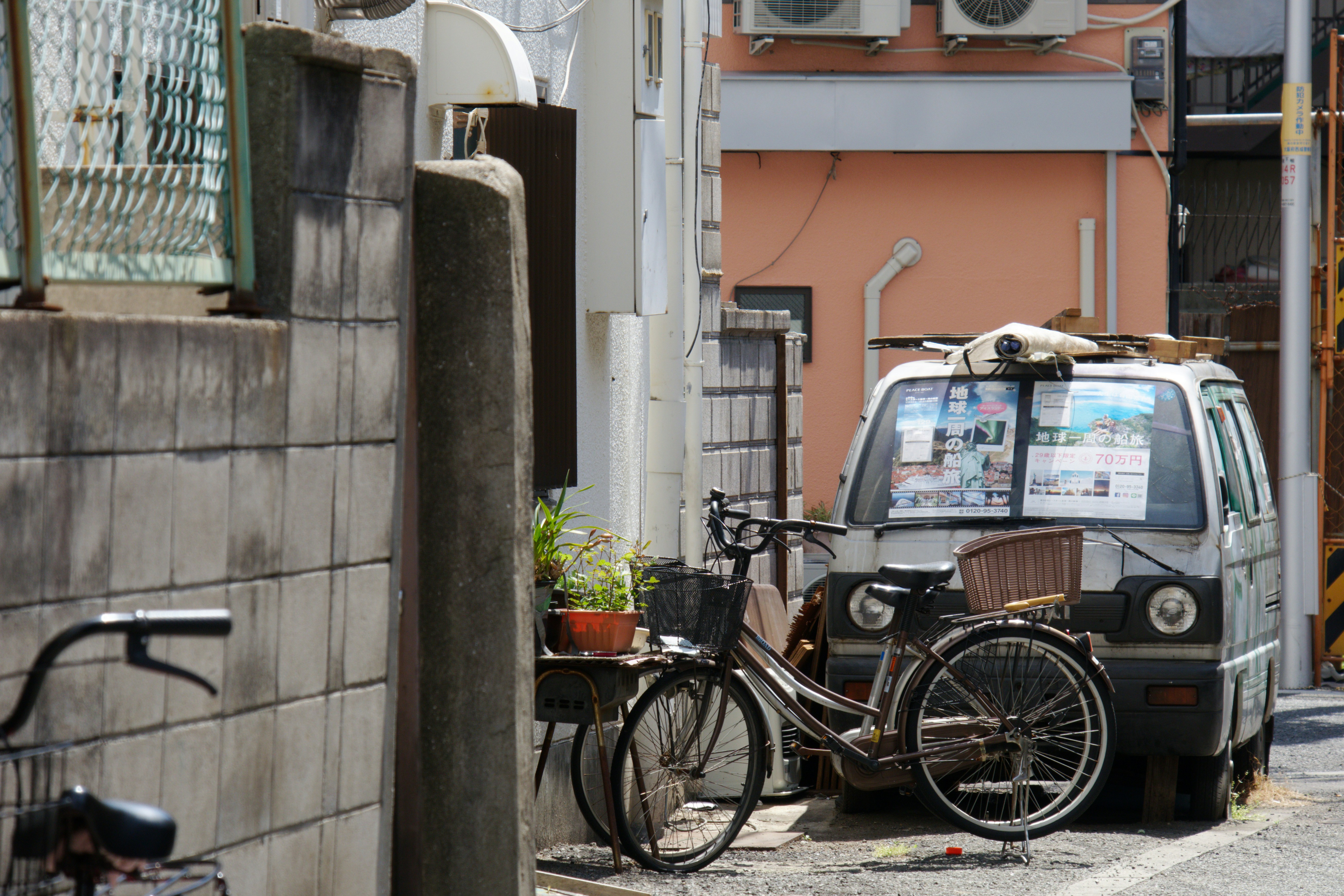 Bicycle and van parked on a narrow street - Free Photo on Unsplash