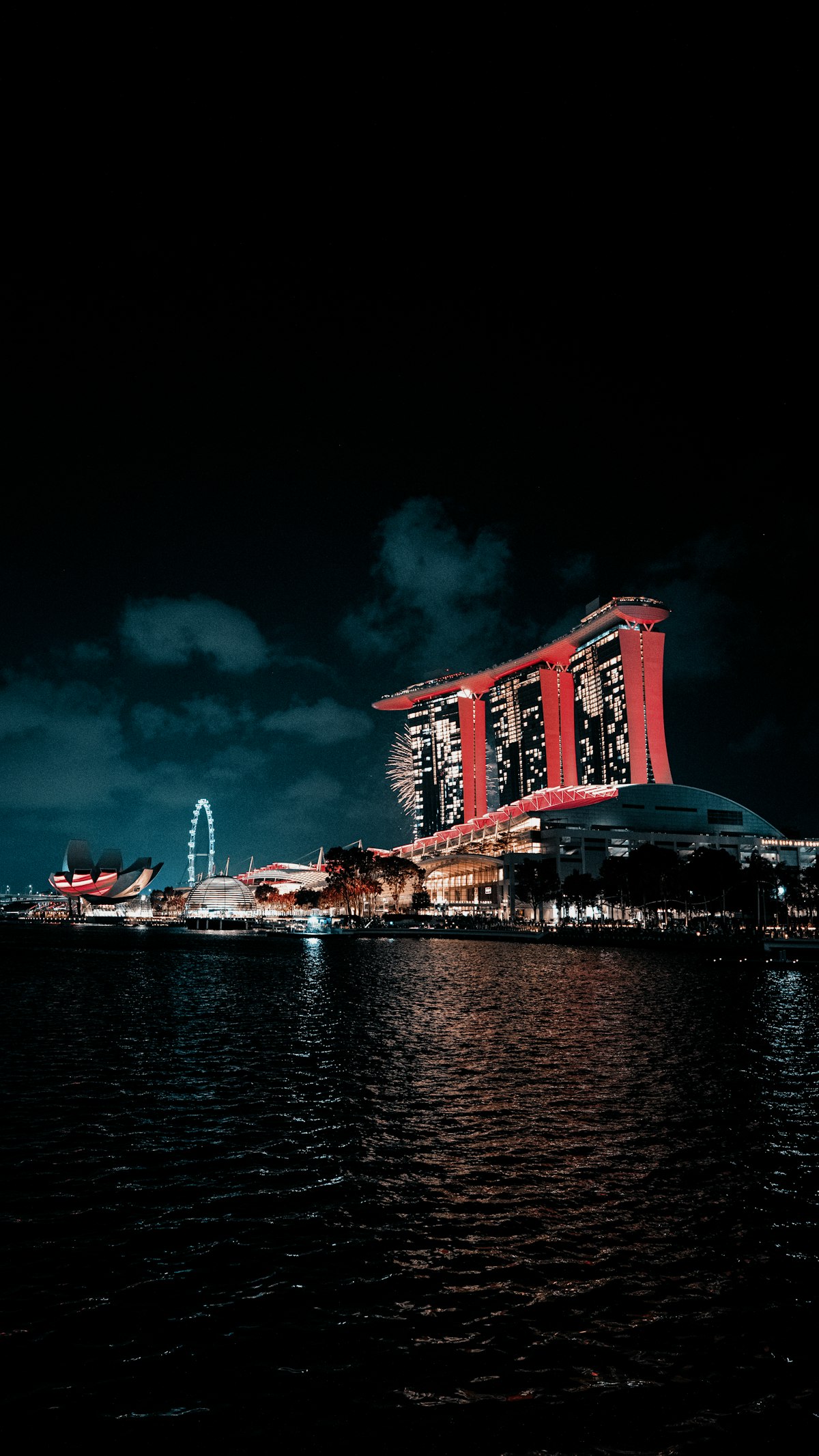 Singapore November — Marina Bay Sands illuminated at night during the Northeast Monsoon season