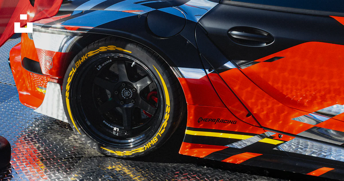 Shutterbox Racing Graphics Images A stylish car with colorful racing graphics. photo – Free Sports car ...