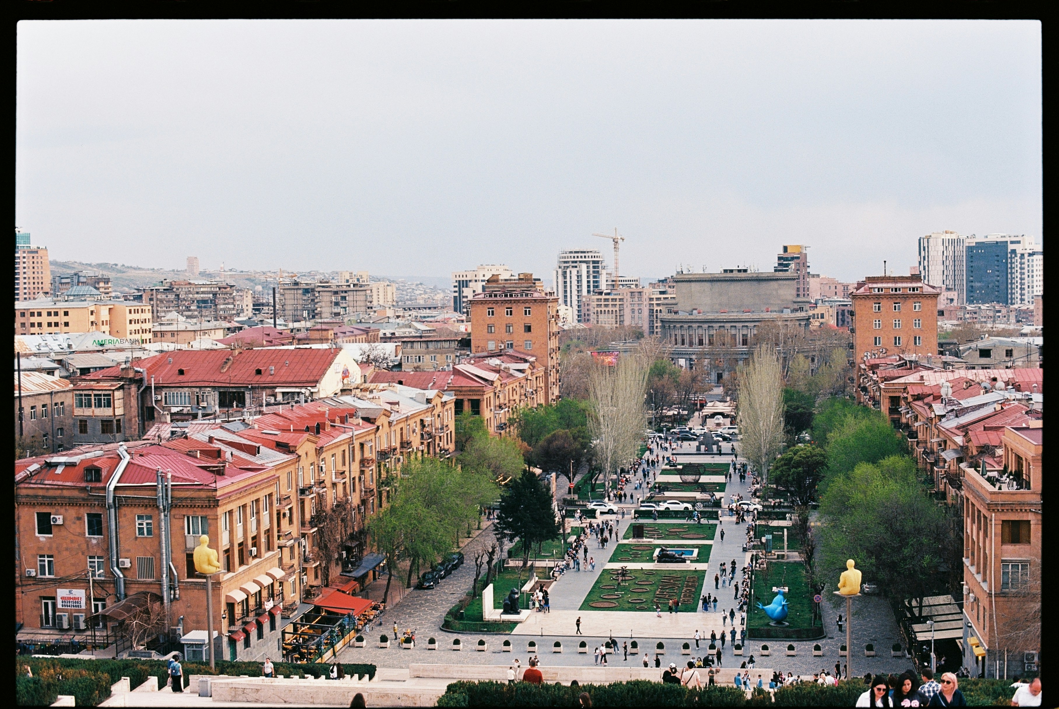 A view of a city square and buildings.