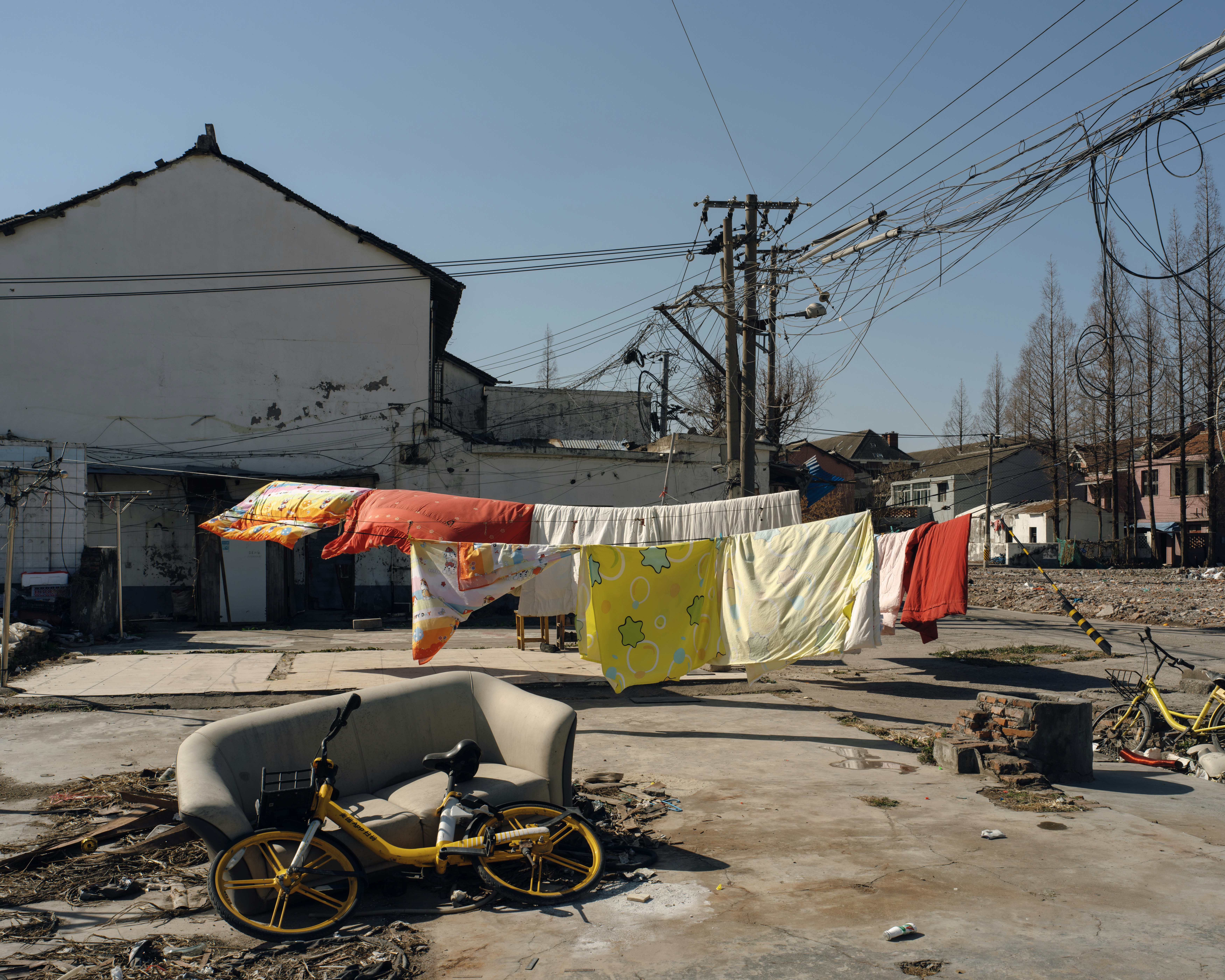Laundry dries in a sunny urban setting.