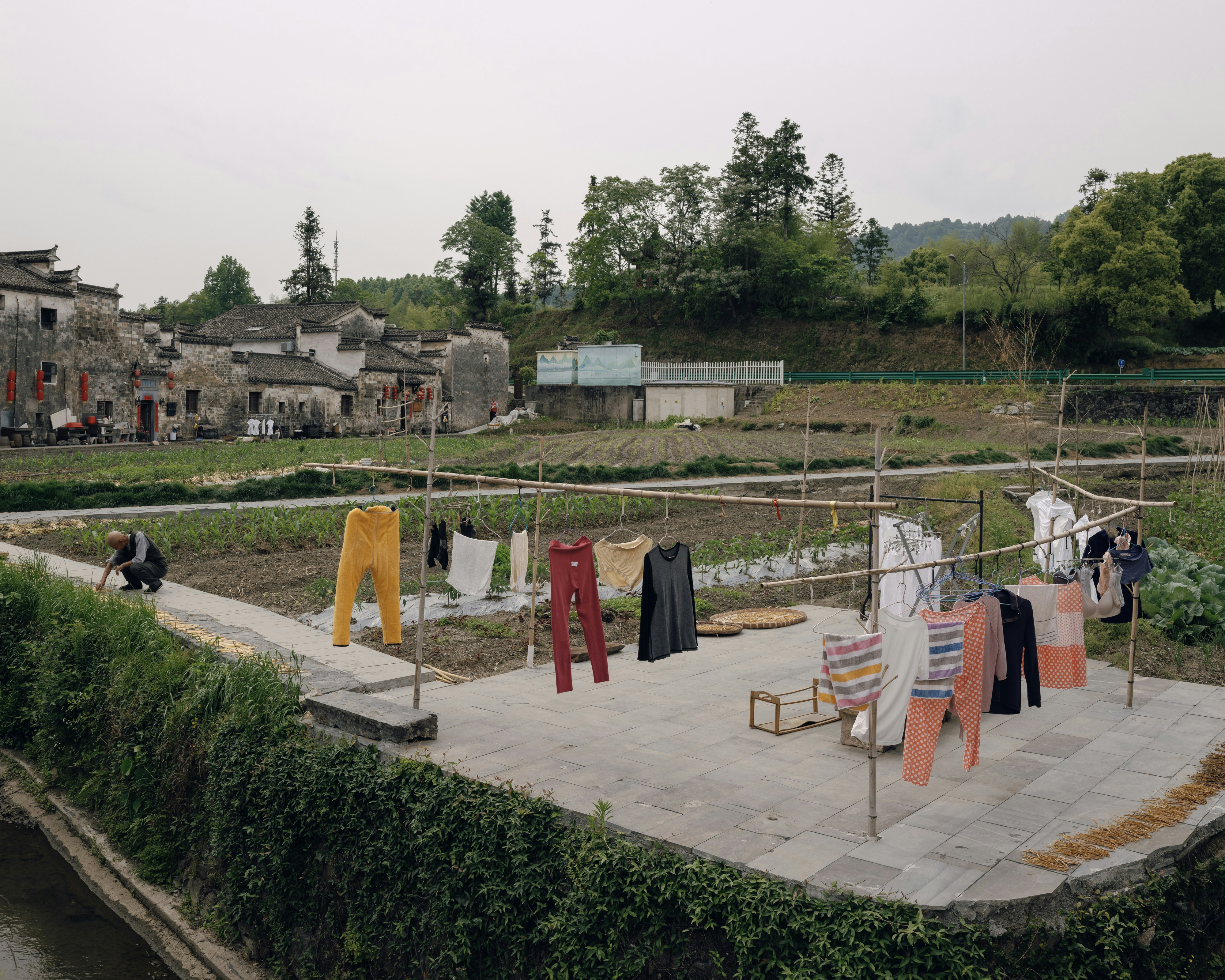 Clothes are hanging to dry in a rural village.
