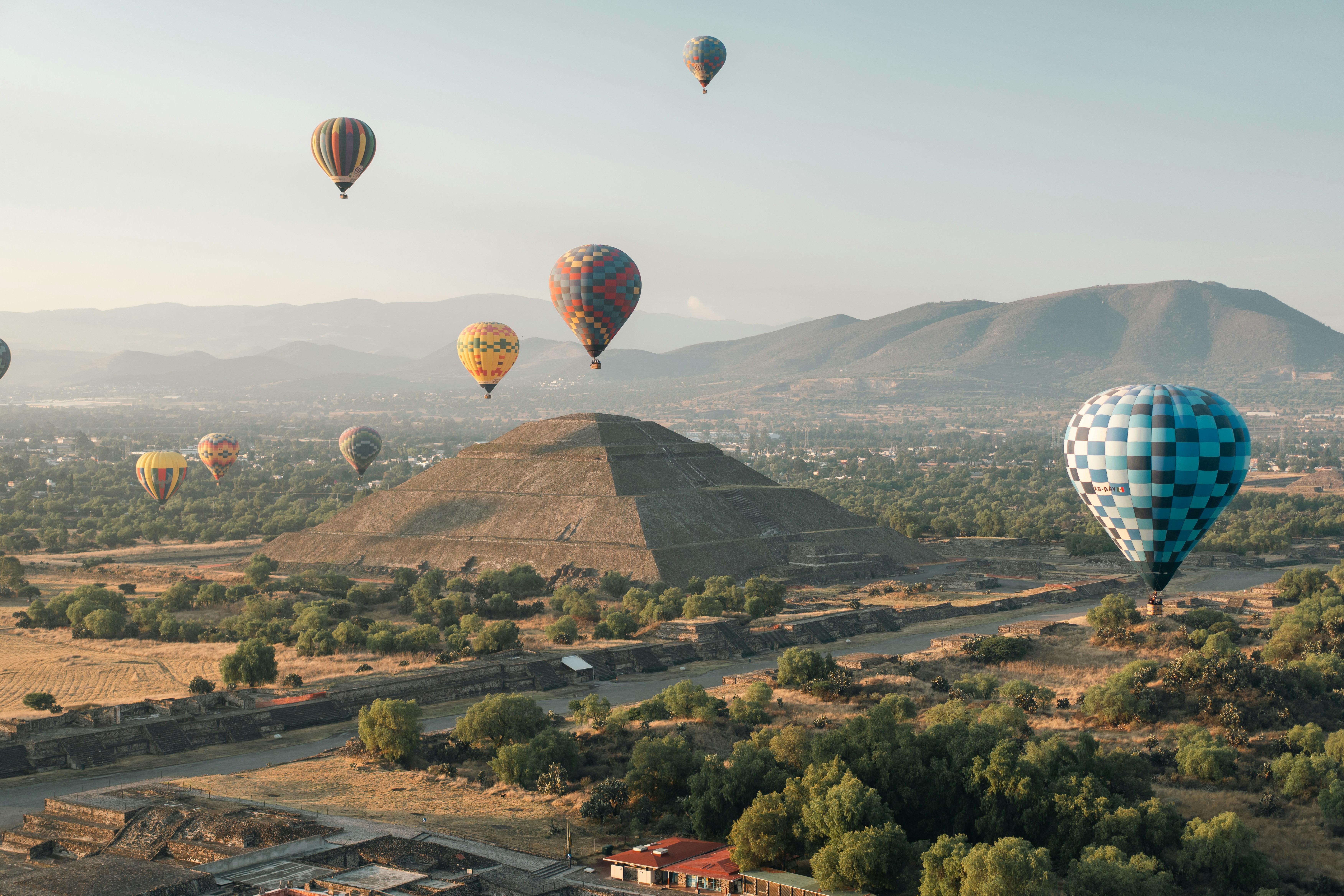 Hot air balloons fly over a pyramid. photo – Free Outdoors Image on ...