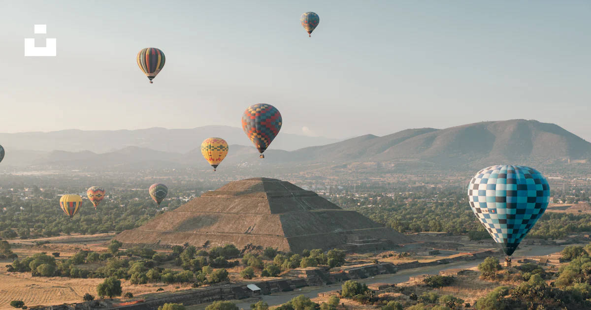 Hot air balloons fly over a pyramid. photo – Free Outdoors Image on ...