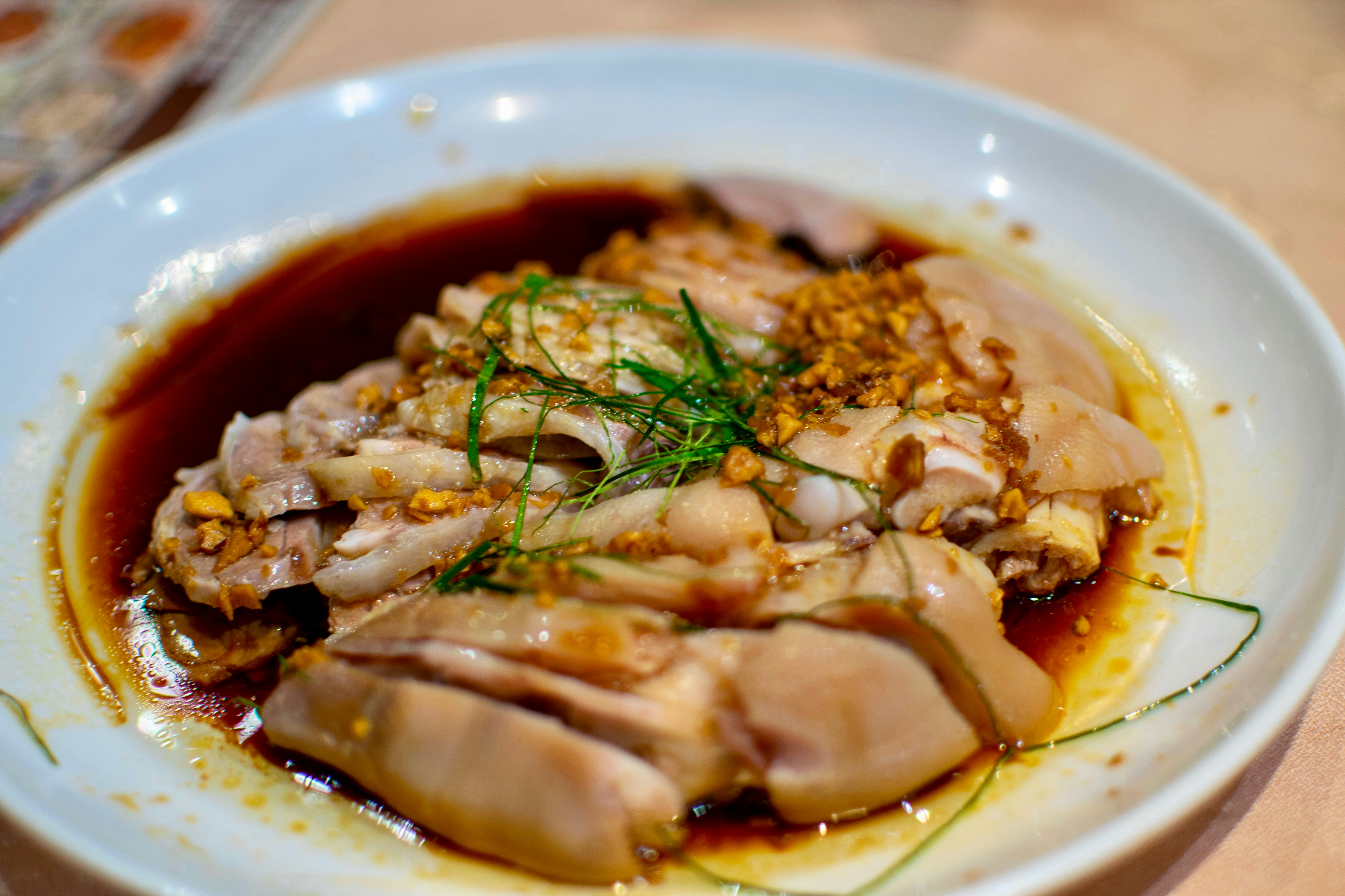 Chicken dish with sauce and herbs.