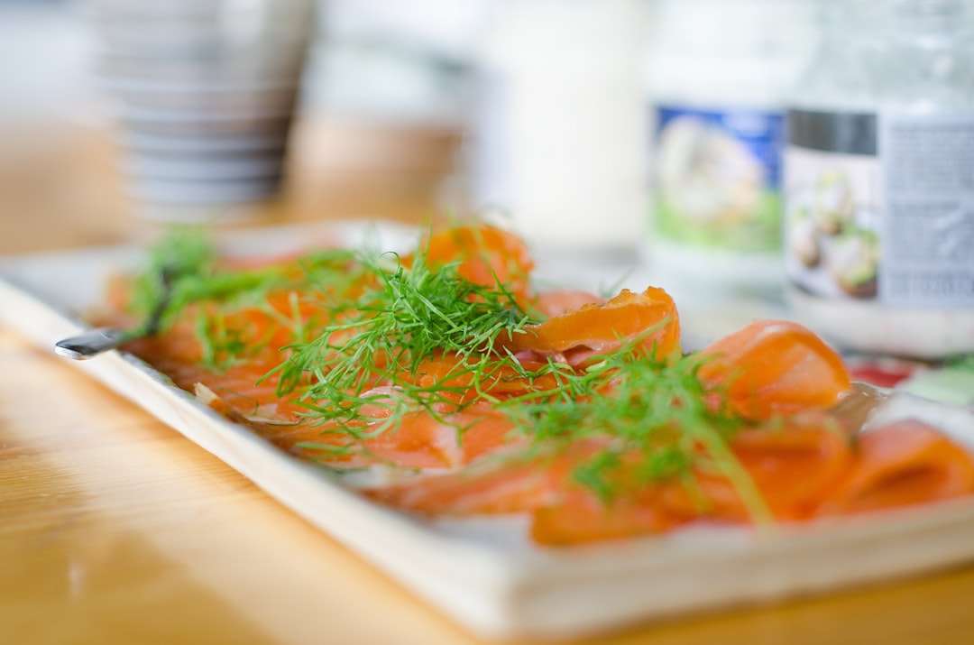 Smoked salmon and dill on a rectangular serving plate.