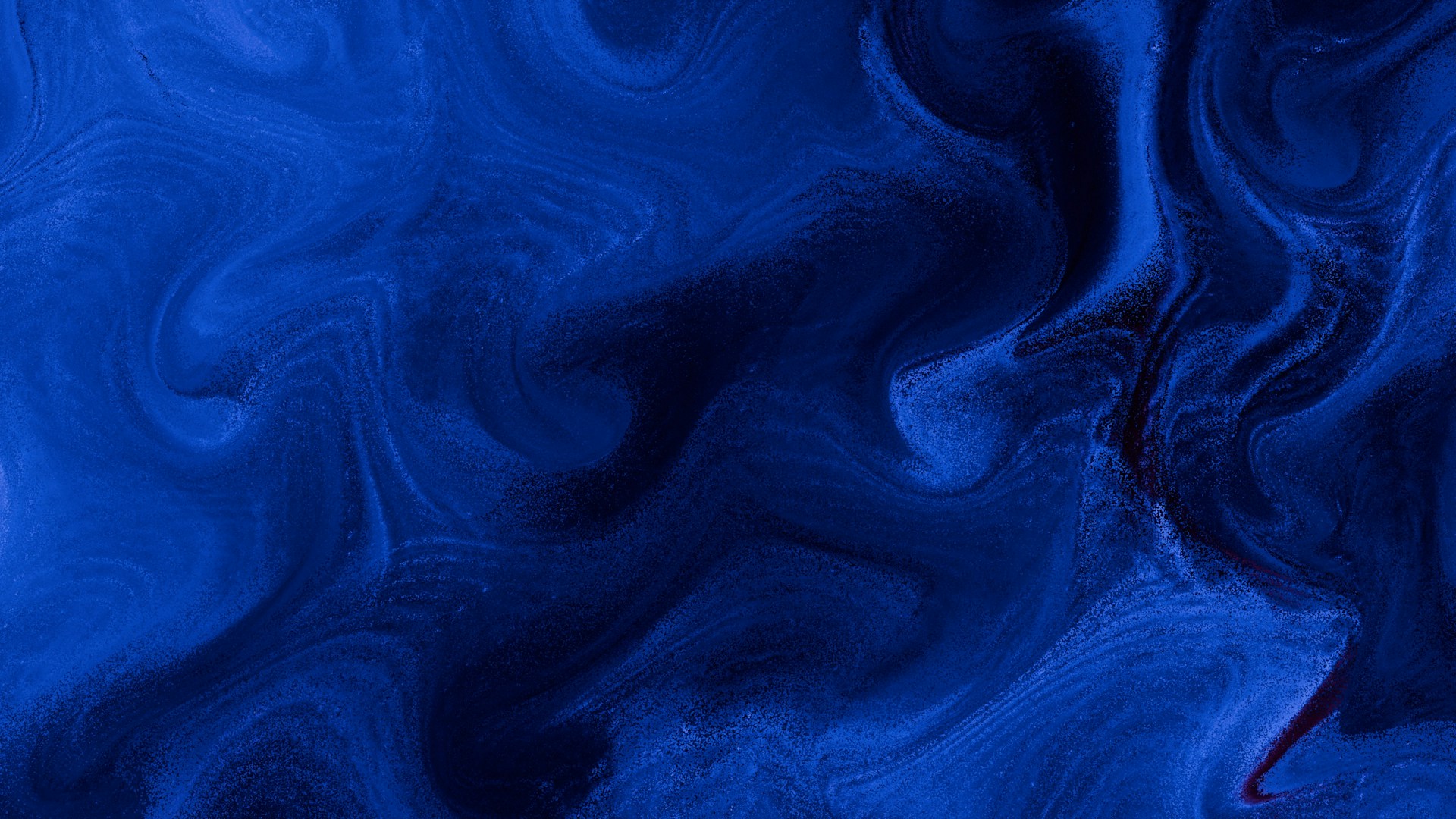 Swirling blue abstract art with dark shadows.