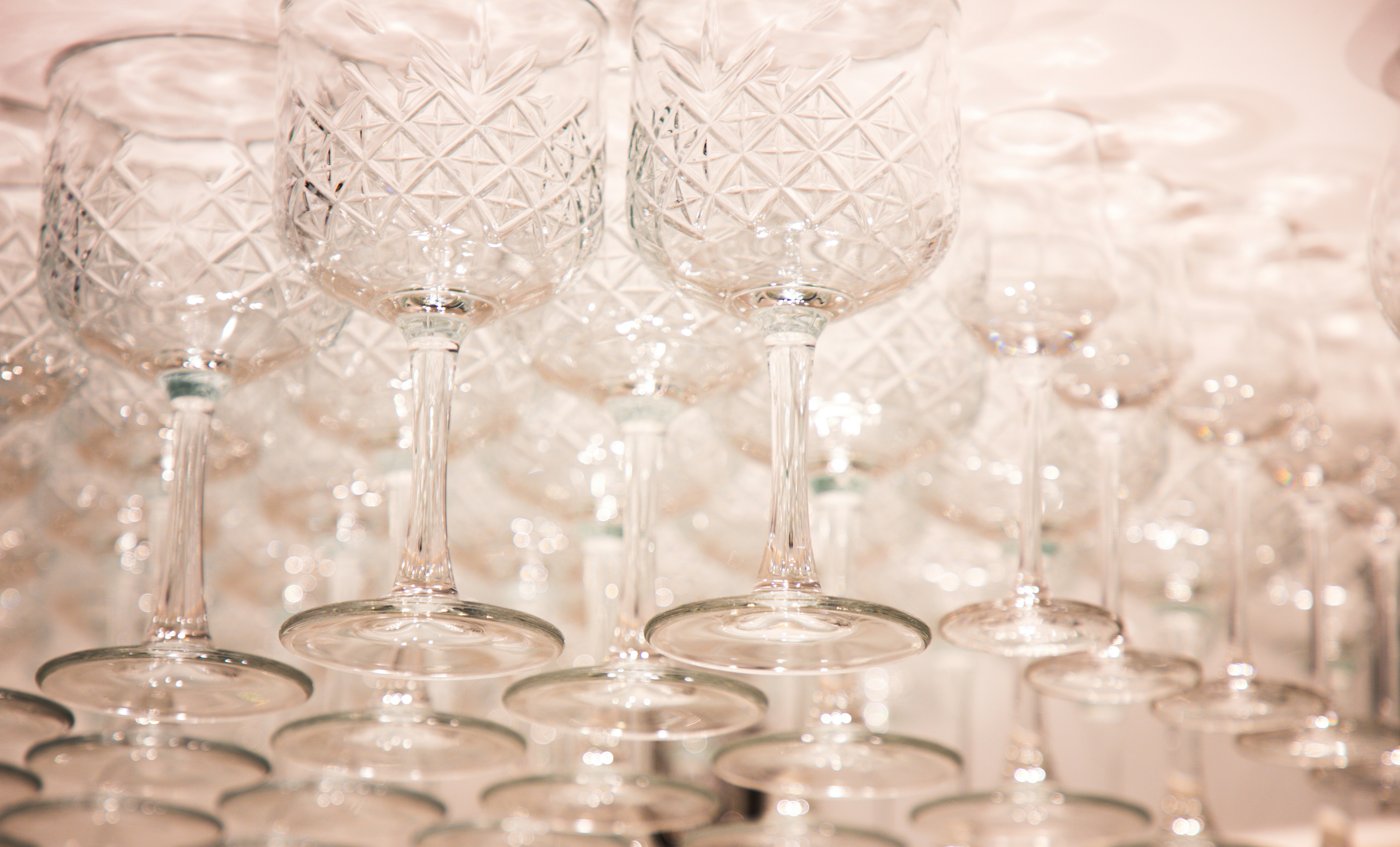 Elegant wine glasses hanging upside down