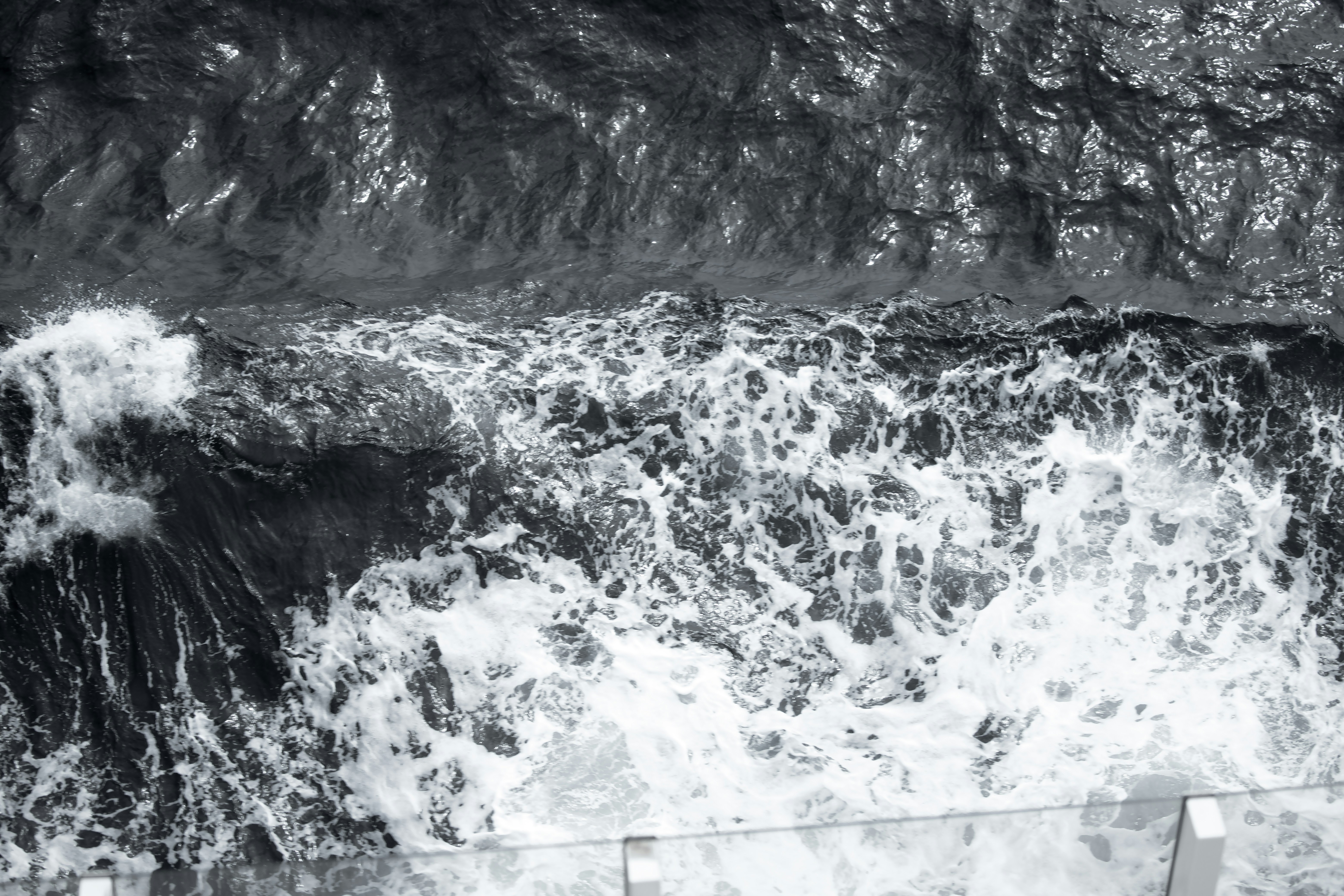 Water is splashing on a surface, creating sea foam.