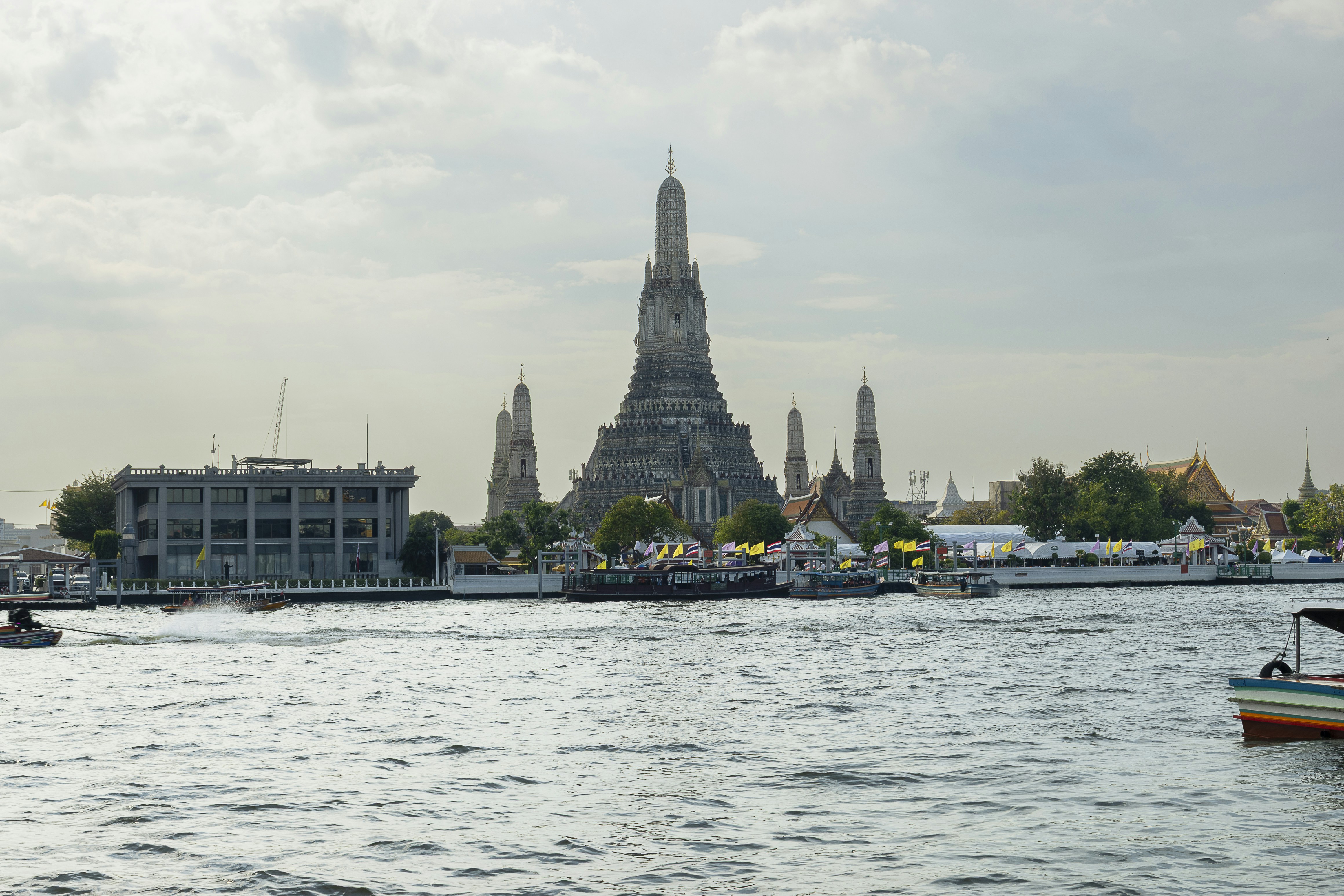 Wat Arun temple with its iconic spires along the Chao Phraya River