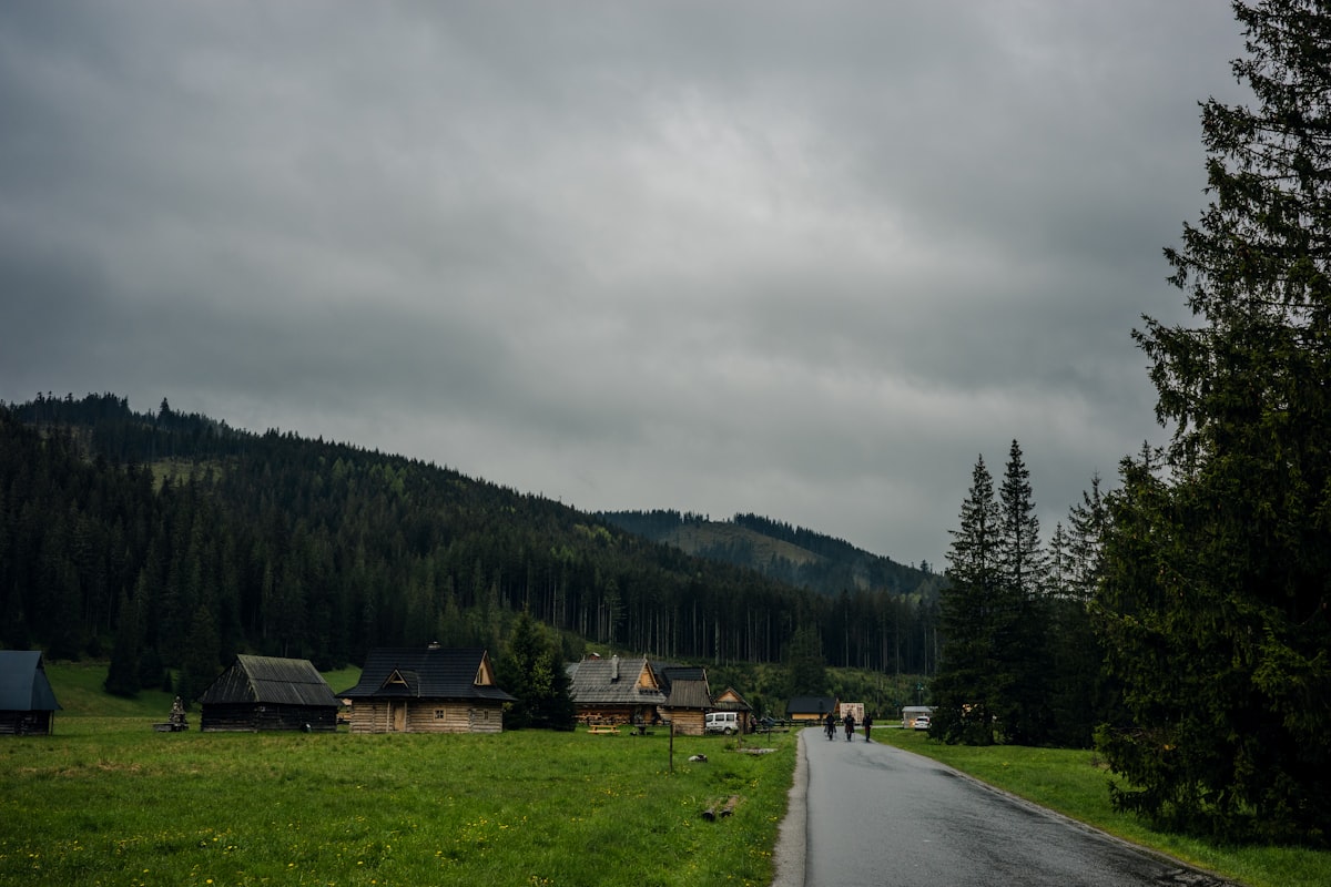 A road leads through a green valley.