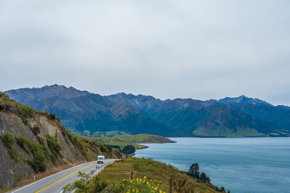 Dramatic South Island New Zealand landscape with mountains and open road