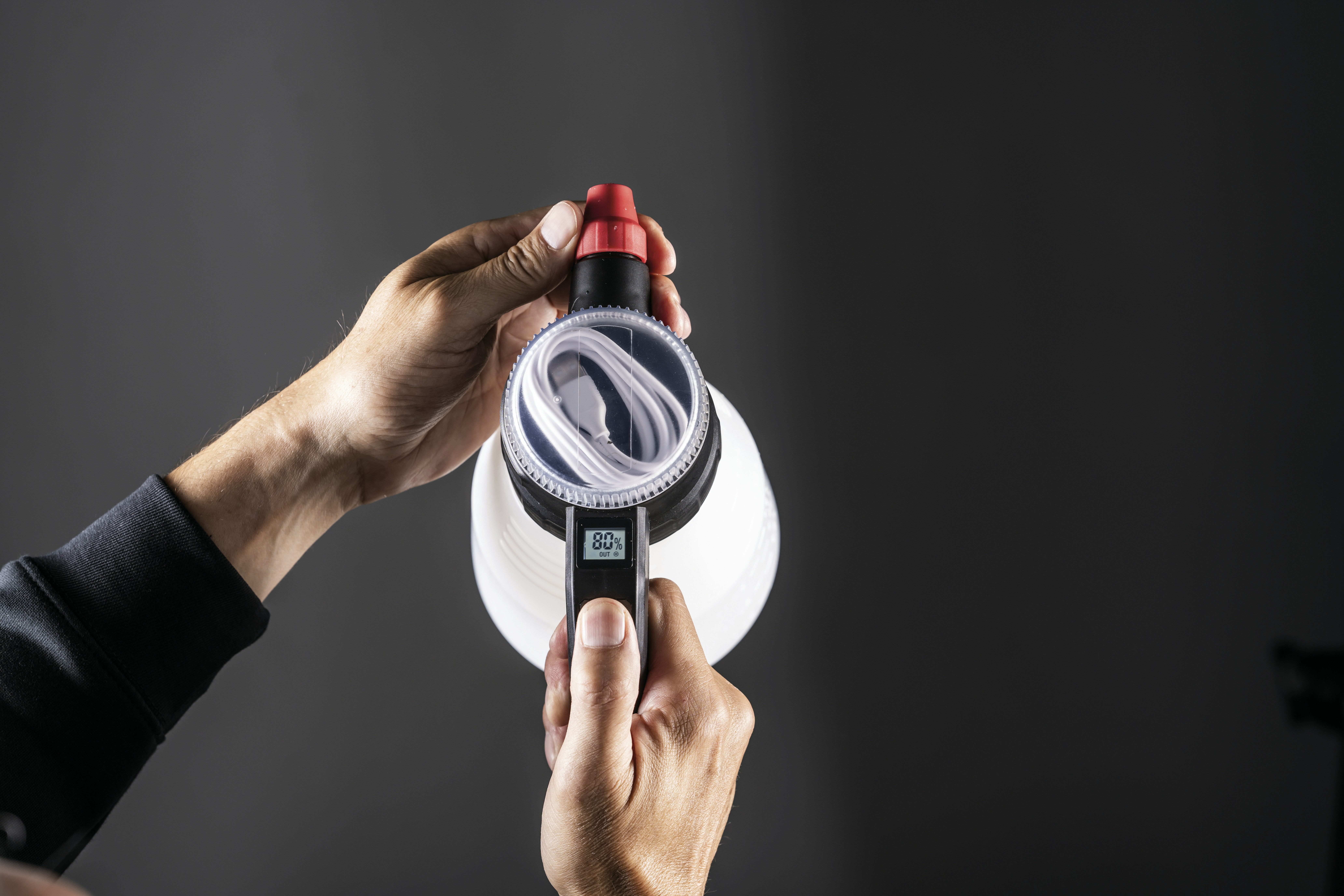 A person is holding a water bottle.