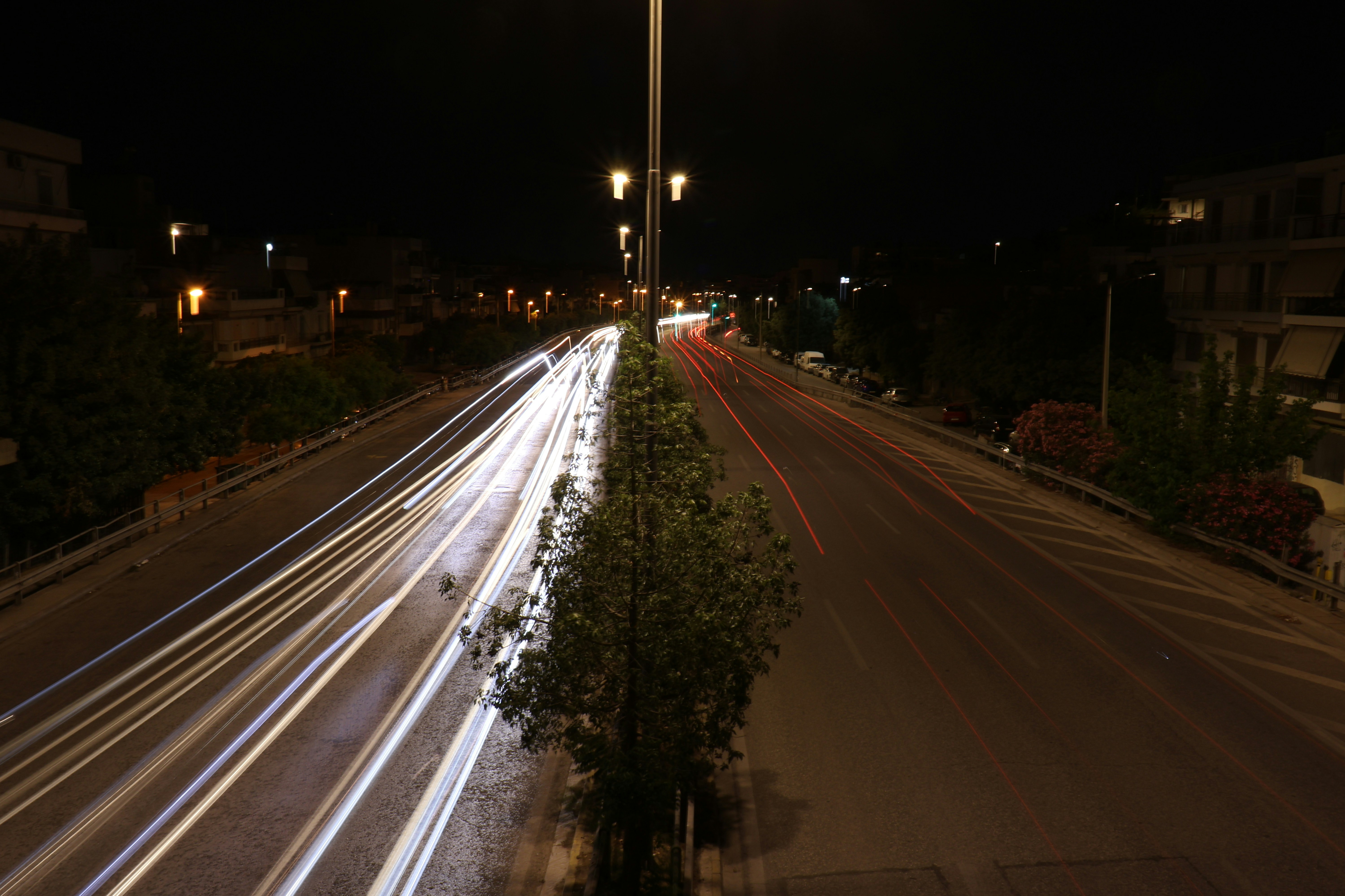 Cars' headlights create streaks of light at night.