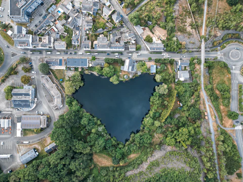 An aerial view shows a heart-shaped lake.