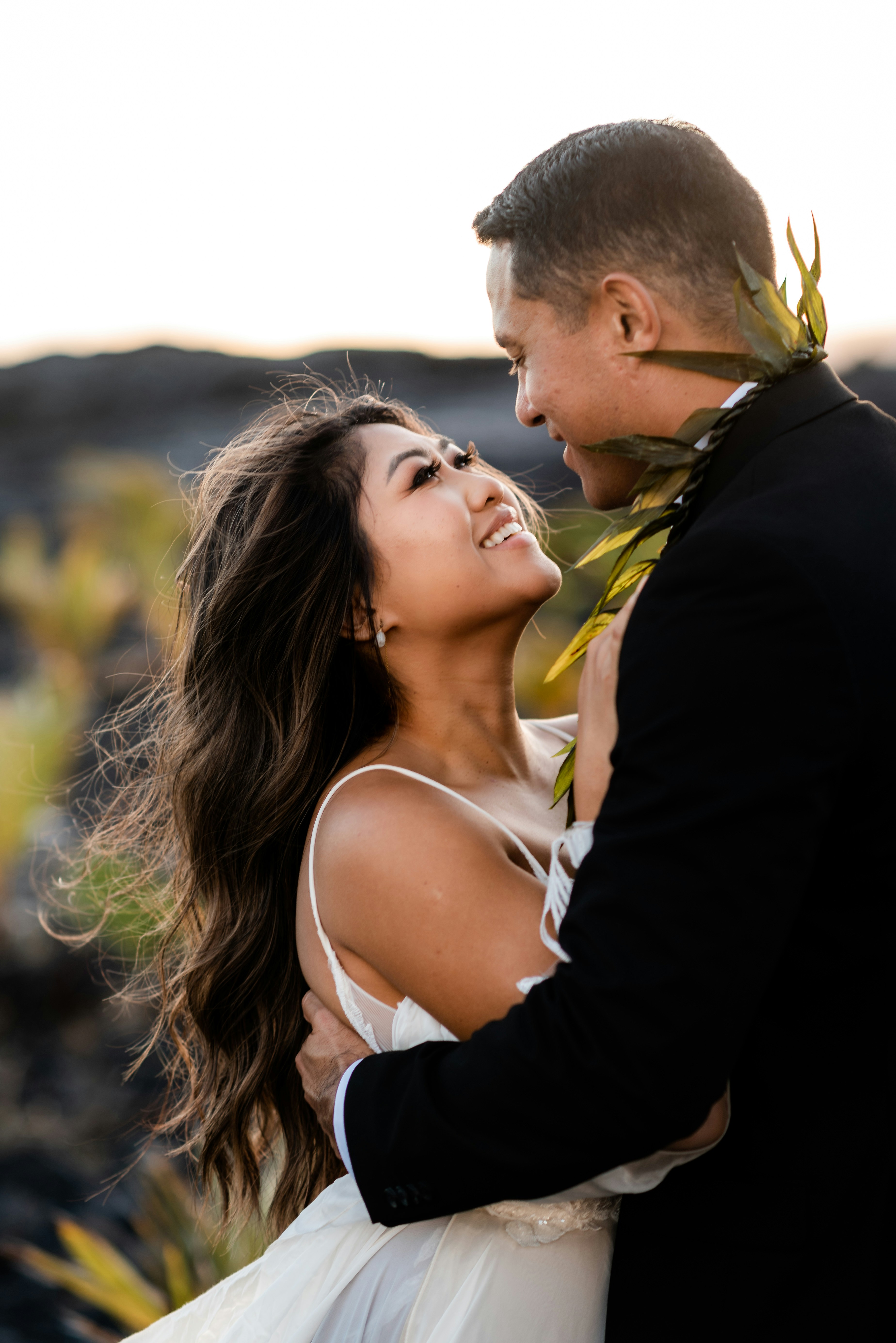 A bride and groom share a loving embrace