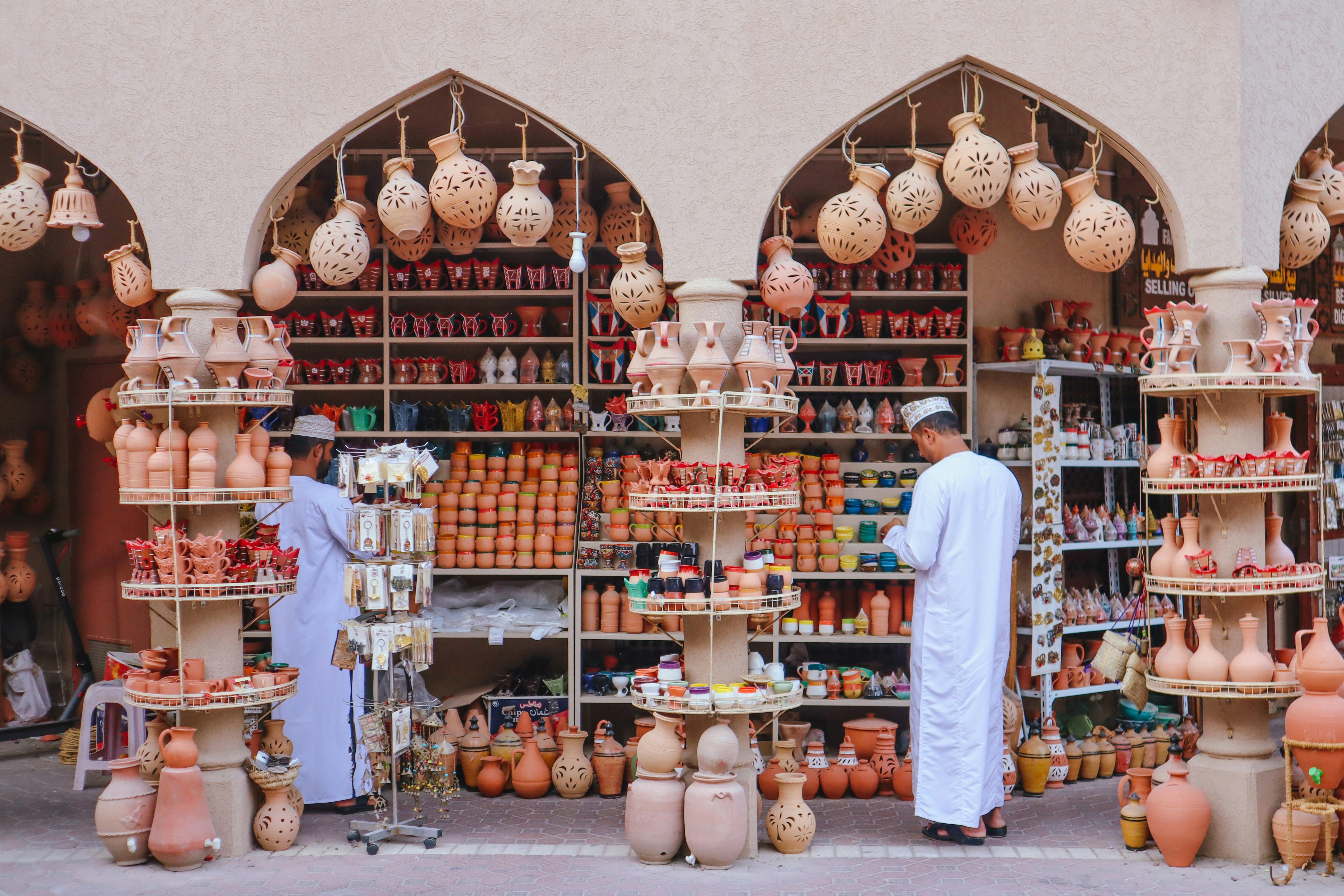 A shop showcases various clay pottery and wares.