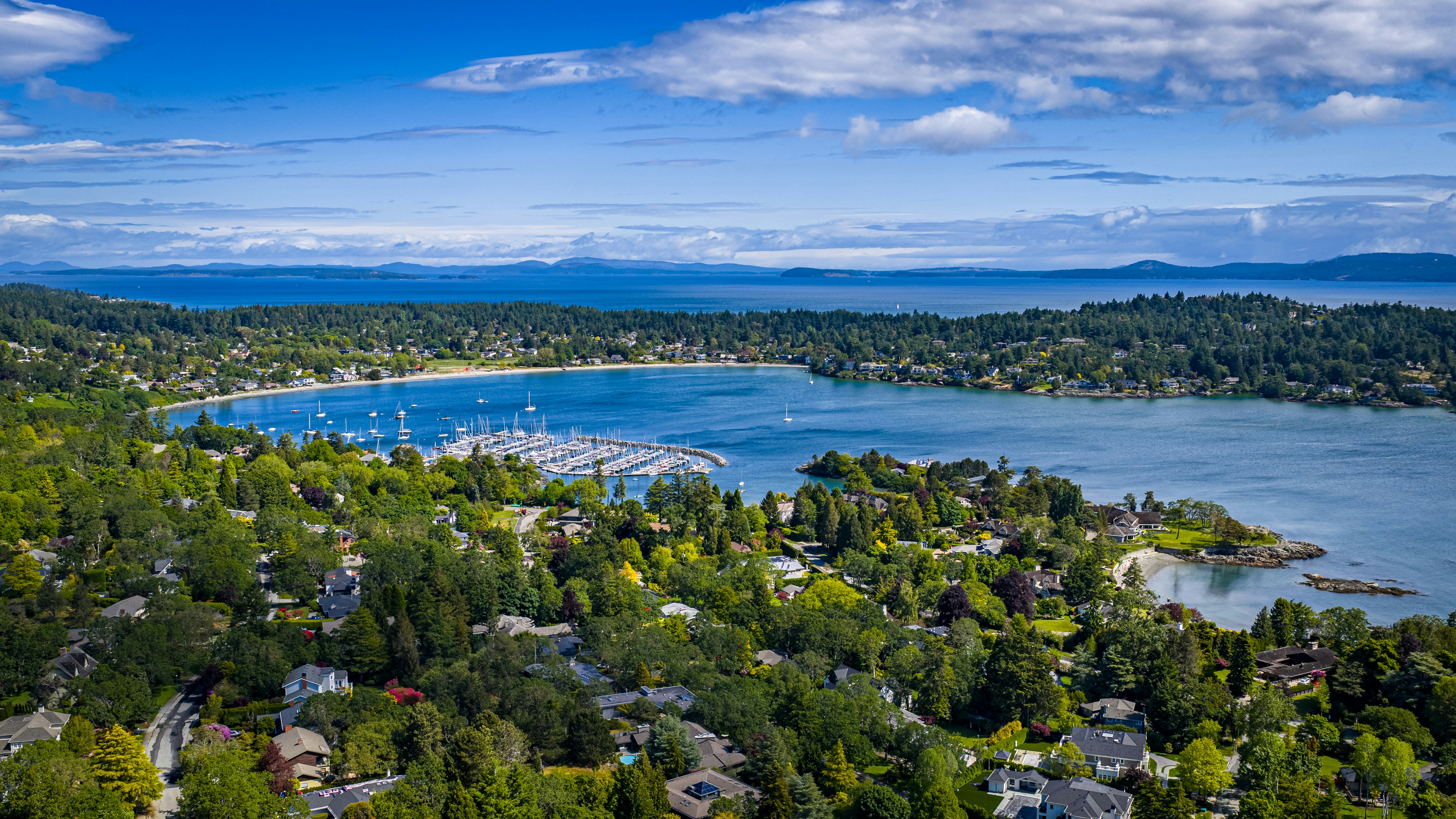 A beautiful coastal landscape with homes and water.
