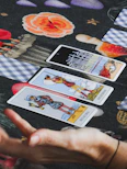 Tarot cards are laid out on a table.