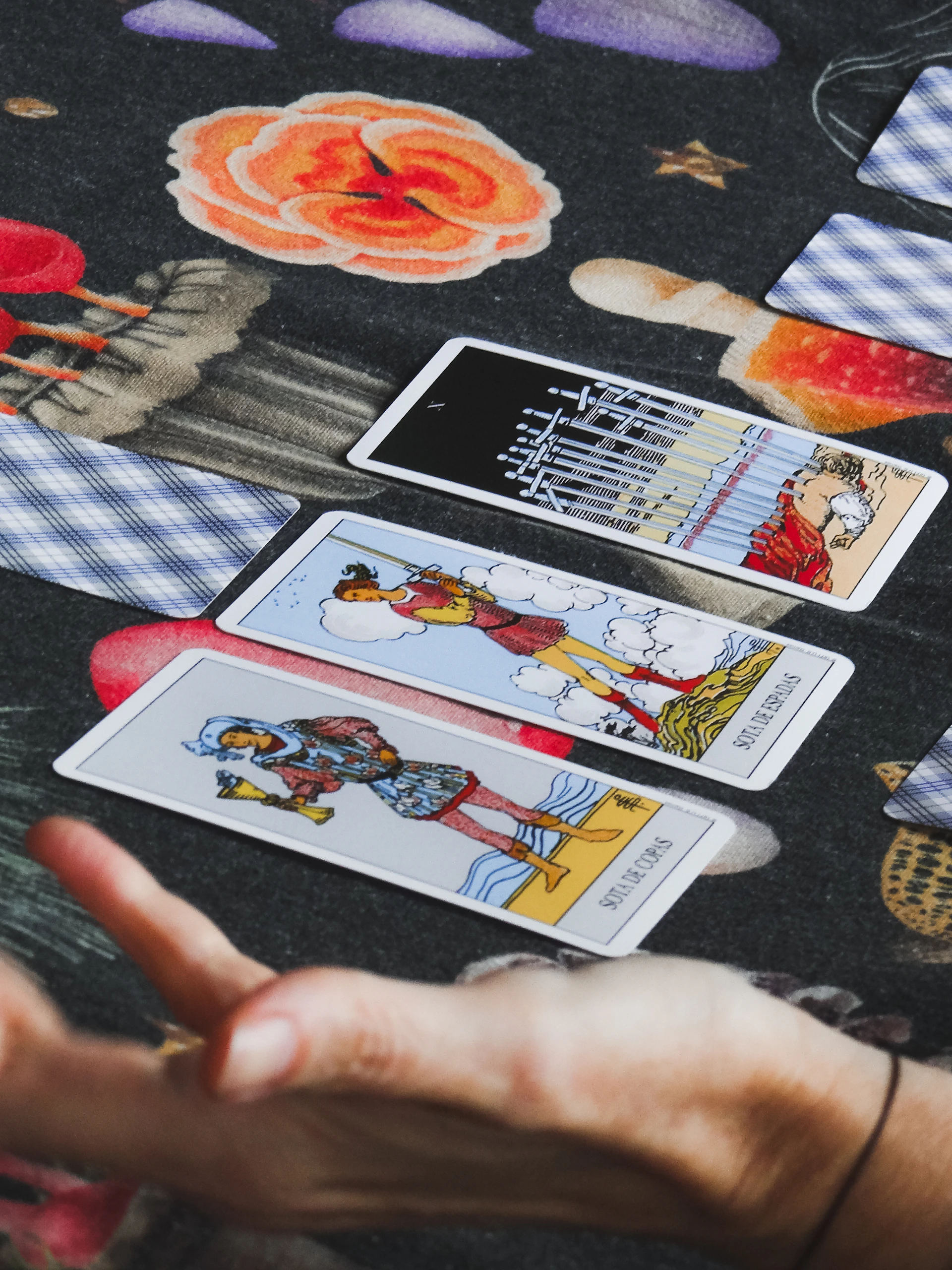 Tarot cards are laid out on a table.