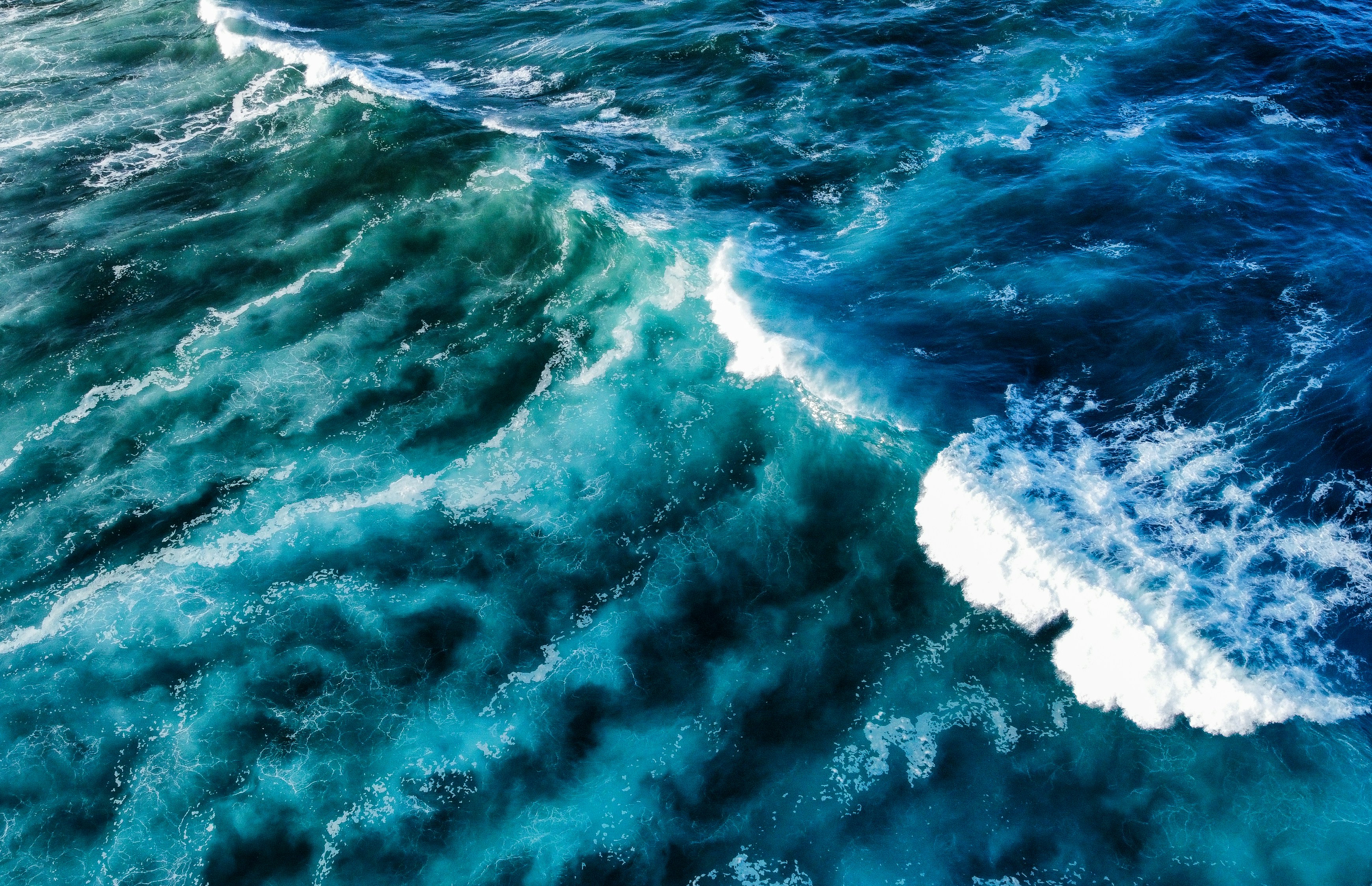 Waves of water crashing across the ocean.