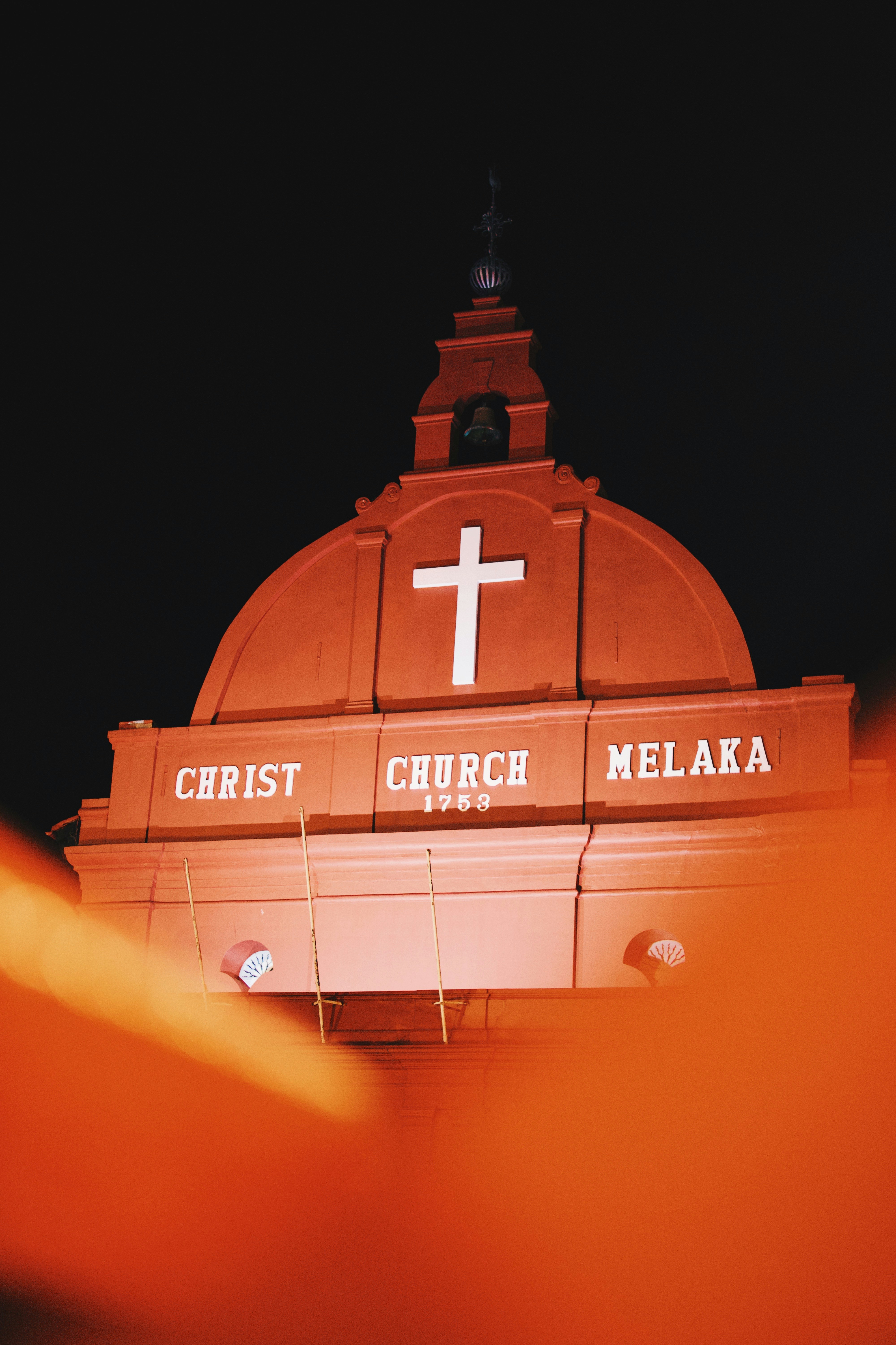 Christ church melaka, a historical landmark at night.
