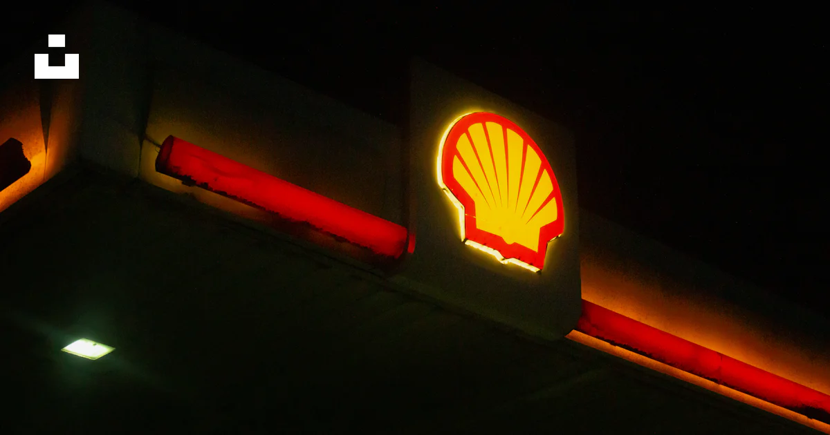 Shell gas station sign illuminated at night. photo – Free Night Image ...