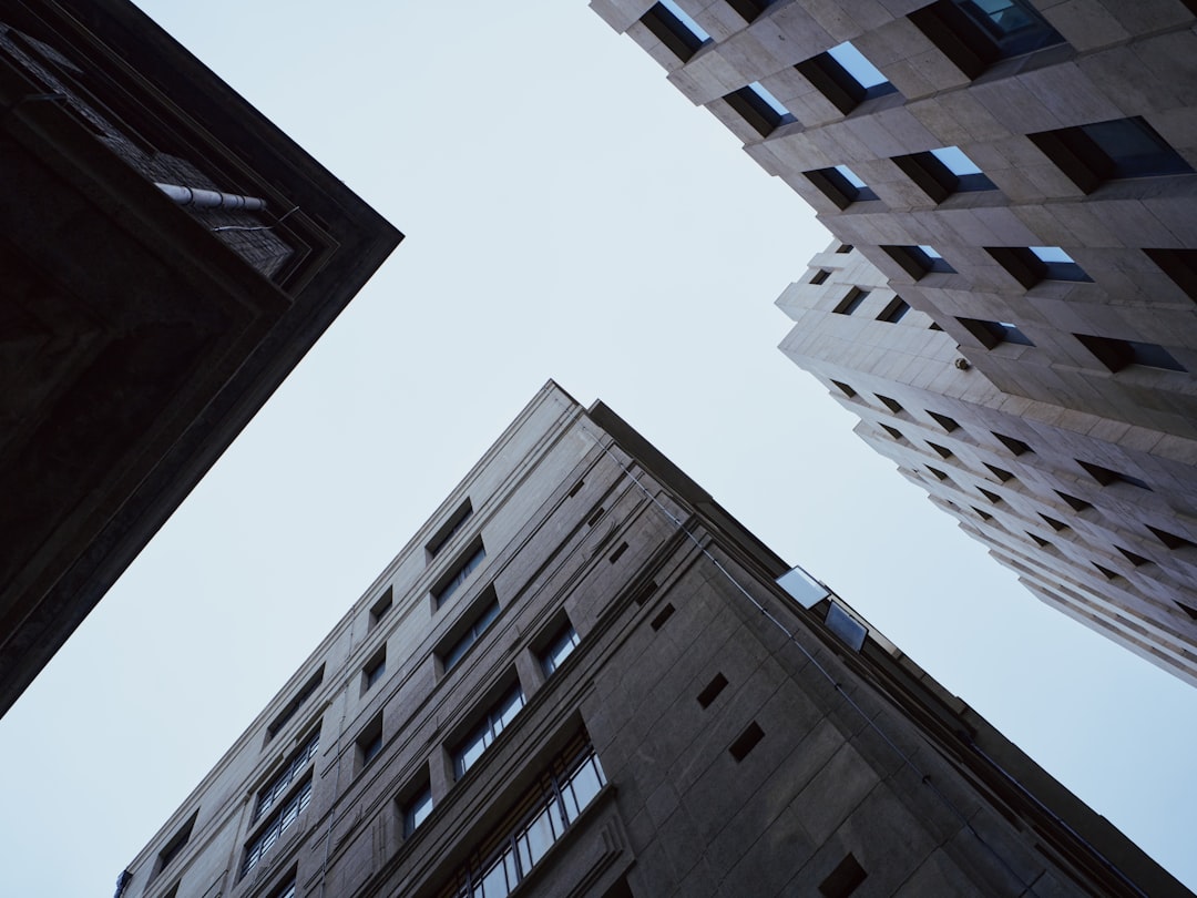 Tall buildings reaching up towards the sky.,
